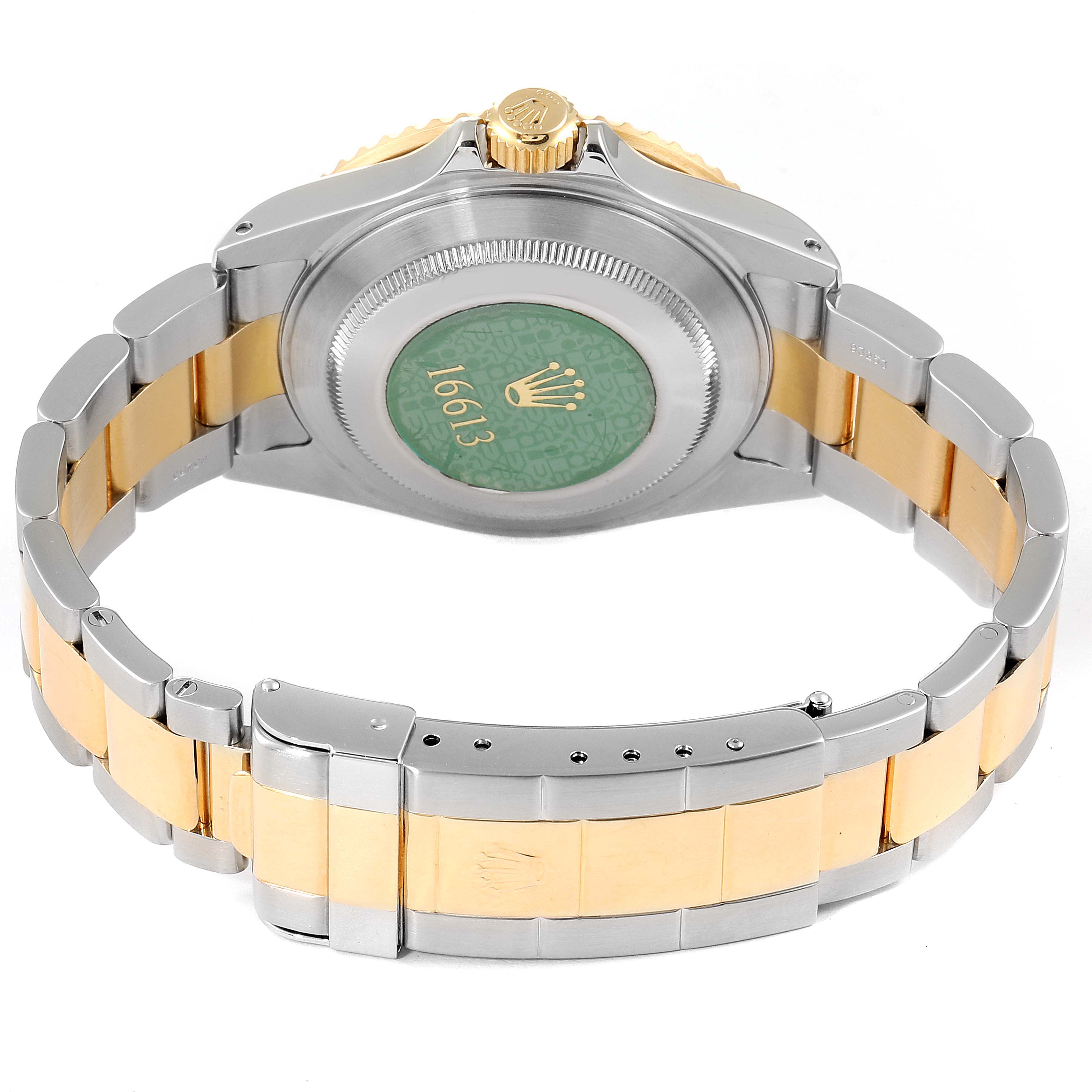 The image shows the back and band of a Rolex Submariner 16613 Men
s Steel and Gold (two tone) Blue Dial 16613 Men
s Steel and Gold (two tone) Blue Dial watch, highlighting the clasp, bracelet, and case back.