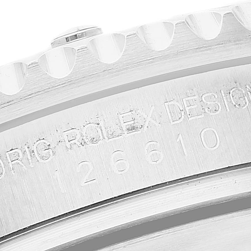 This close-up image shows part of the bezel and the engraved serial number on a Rolex Submariner 126610 Men
s Stainless Steel Black Dial 126610 Men
s Stainless Steel Black Dial watch.