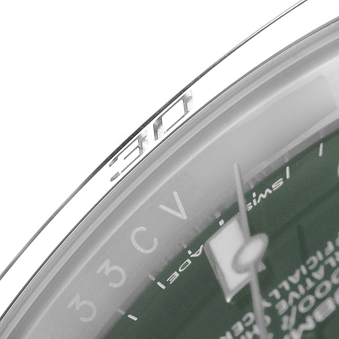 The image shows a close-up of the bezel and a part of the dial of a Rolex Submariner 116610LV Men
s Stainless Steel Green Dial 116610LV Men
s Stainless Steel Green Dial watch.