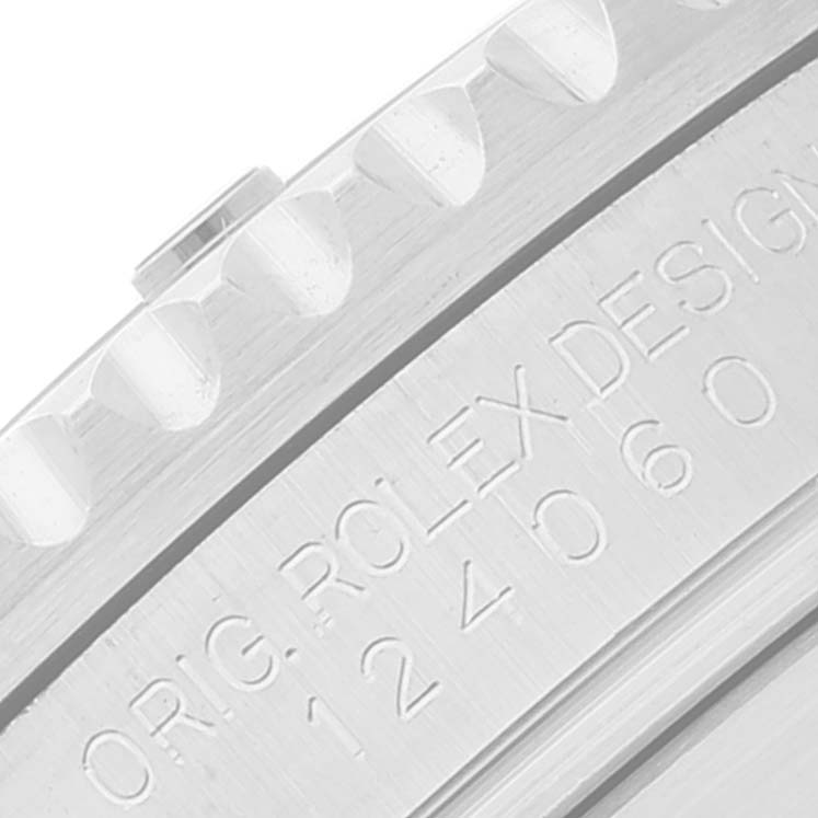 The image shows a close-up of the edge and serial engraving on a Rolex Submariner 124060 Men
s Stainless Steel Black Dial 124060 Men
s Stainless Steel Black Dial watch casing.