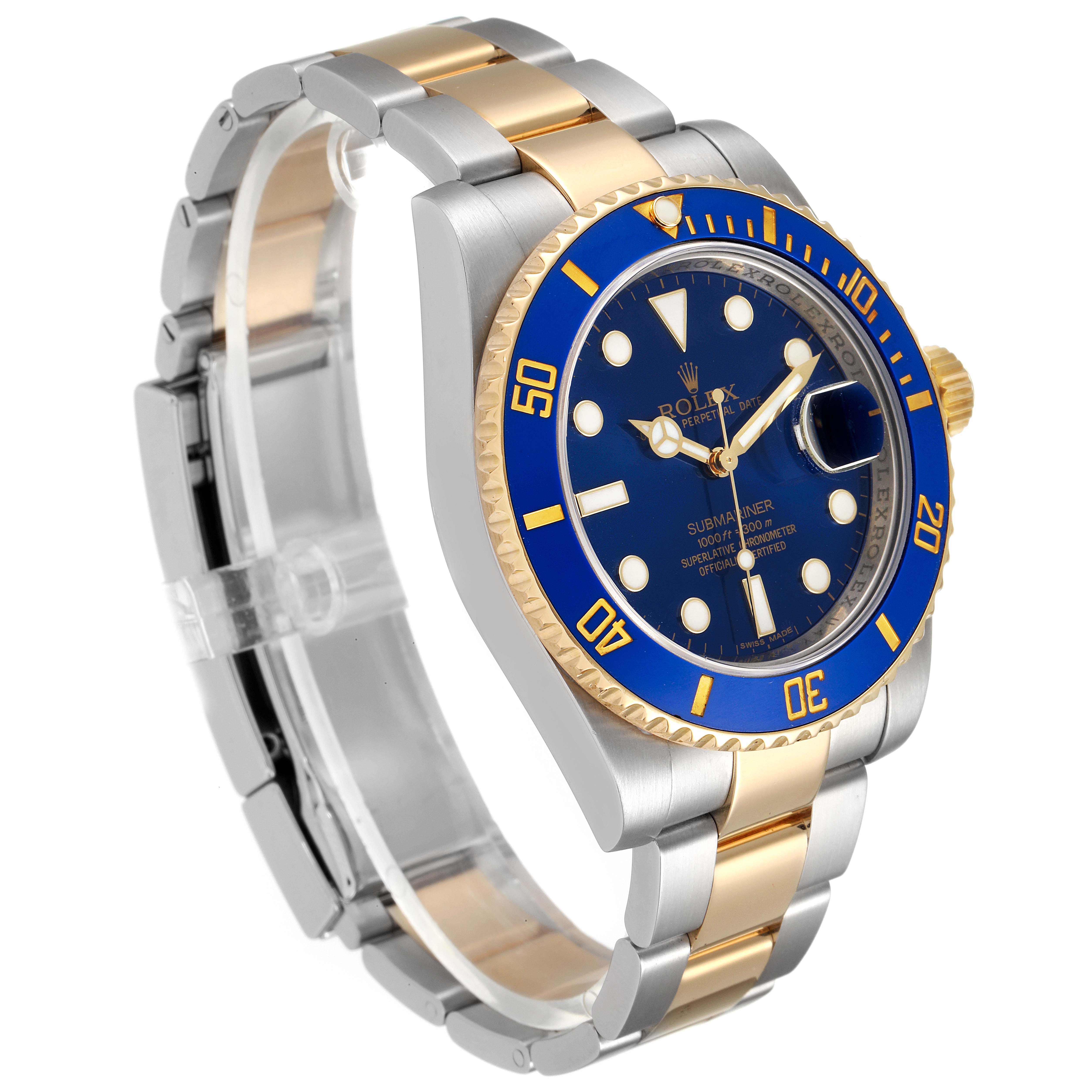 The image shows a Rolex Submariner 116613 Men
s Steel and Gold (two tone) Blue Dial 116613 Men
s Steel and Gold (two tone) Blue Dial watch at a three-quarters angle, highlighting its blue dial, blue bezel, and two-tone bracelet.