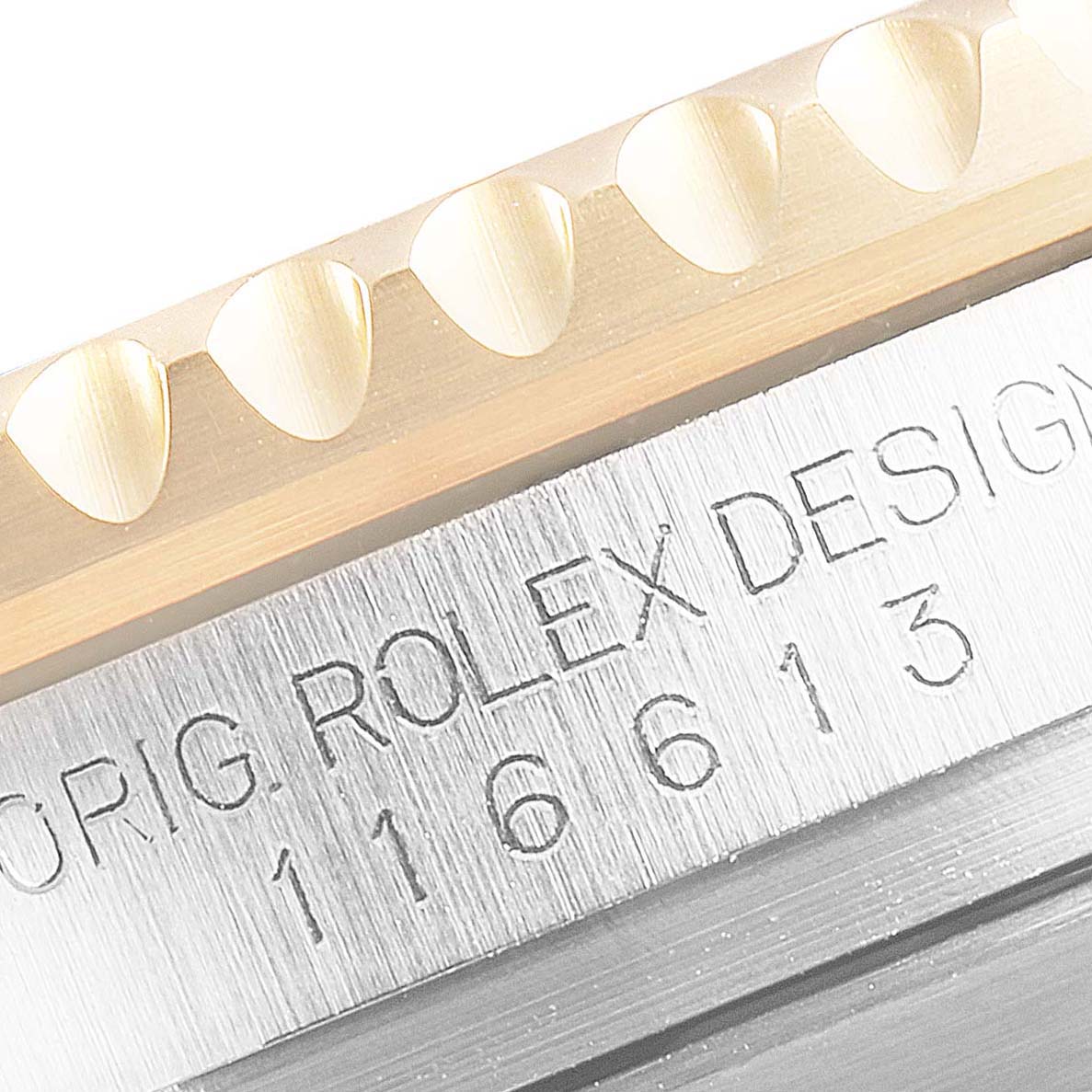 The image shows a close-up of the Rolex Submariner 116613 Men
s Steel and Gold (two tone) Blue Dial 116613 Men
s Steel and Gold (two tone) Blue Dial bezel and case, highlighting the model number and "Rolex Design" engraving.