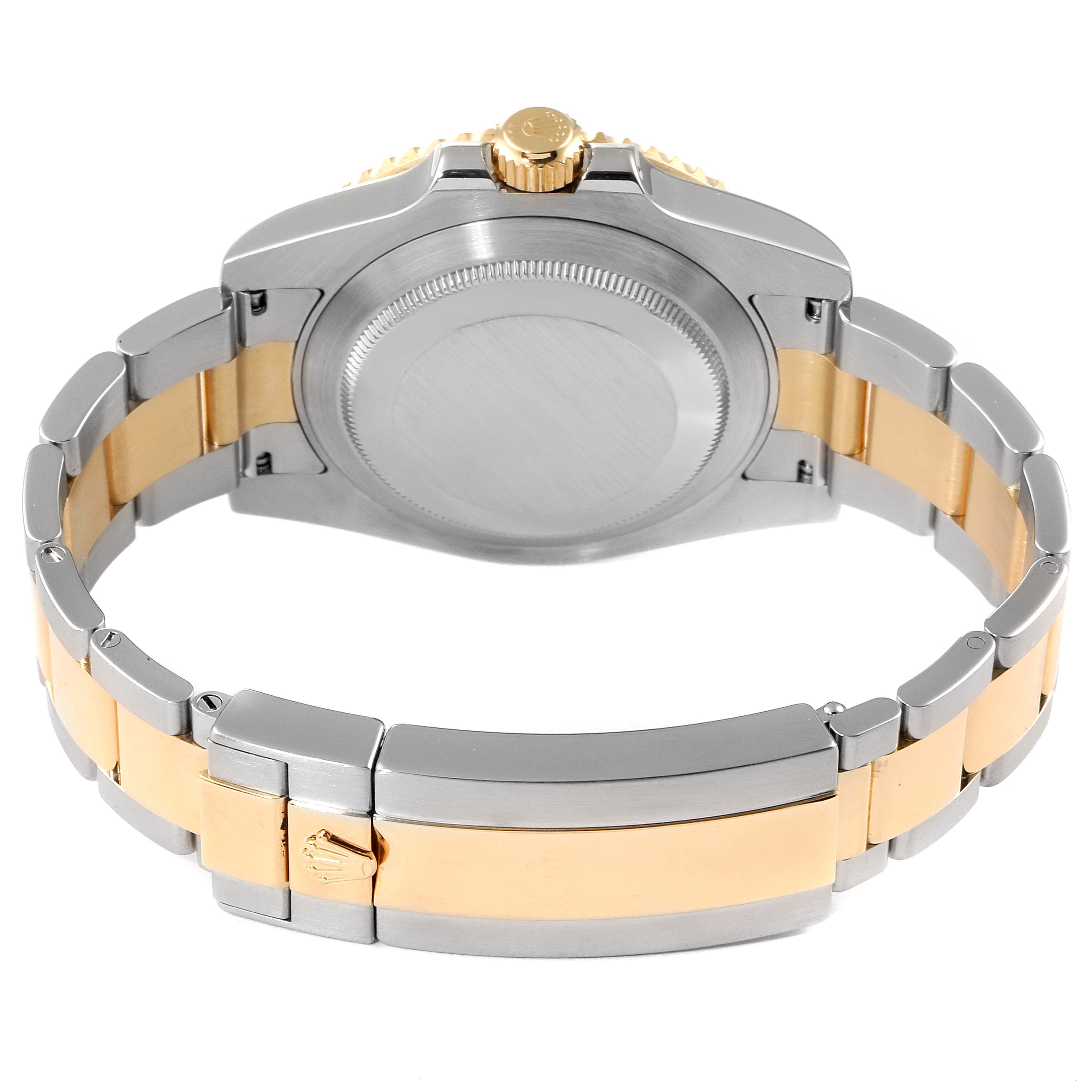 This image shows the back case, crown, and bracelet of the Rolex Submariner 116613 Men
s Steel and Gold (two tone) Blue Dial 116613 Men
s Steel and Gold (two tone) Blue Dial watch from a rear angle.