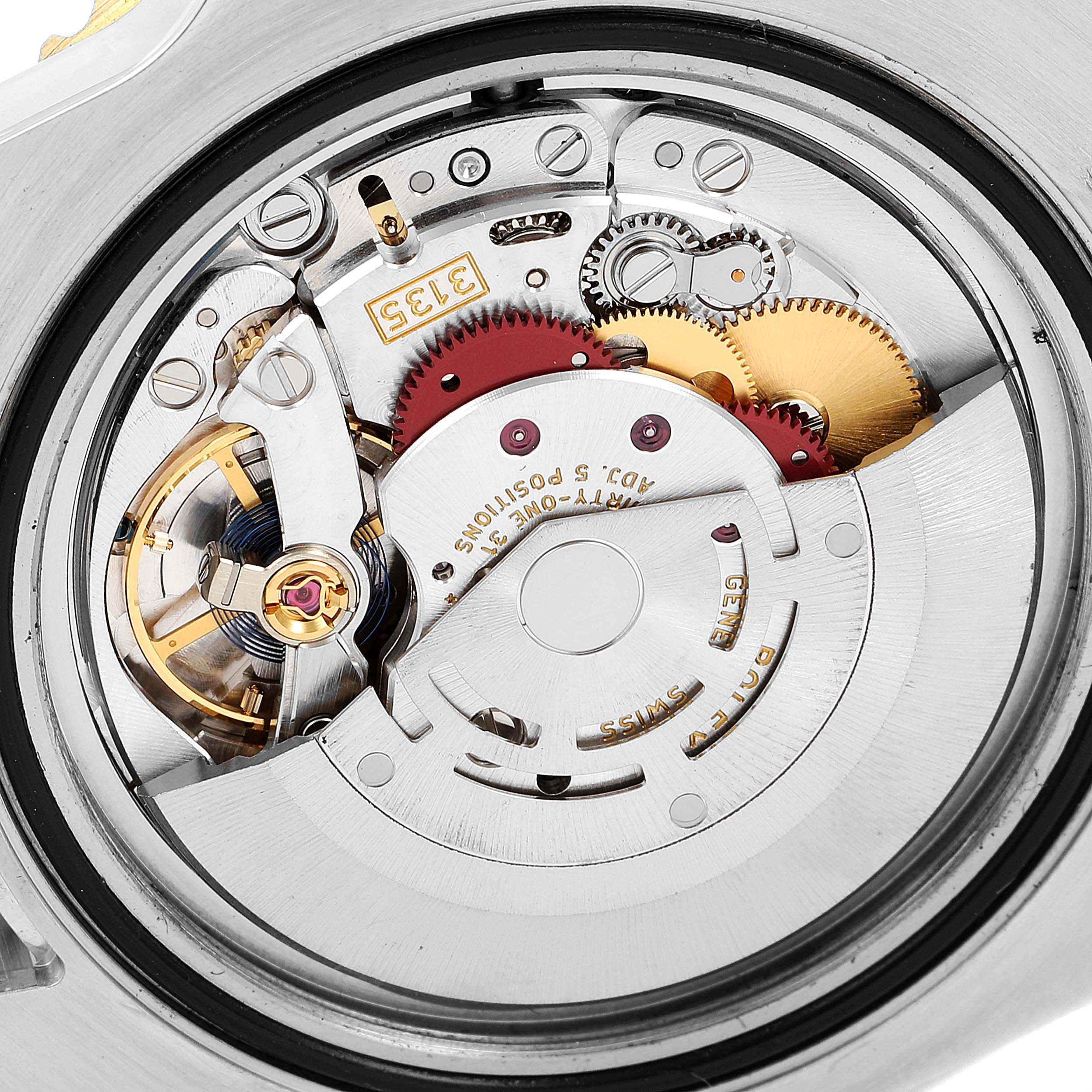This is a close-up shot of the internal movement components of a Rolex Submariner 116613 Men
s Steel and Gold (two tone) Blue Dial 116613 Men
s Steel and Gold (two tone) Blue Dial watch.