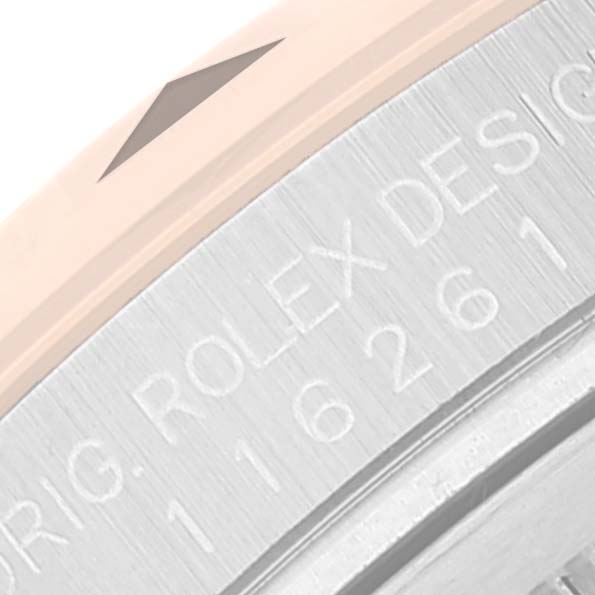 The image shows a close-up, angled view of the serial number engraving on the case side of a Rolex Turn-o-Graph 116261 Men's Steel and Gold (two tone) Black Dial 116261 Men's Steel and Gold (two tone) Black Dial watch.