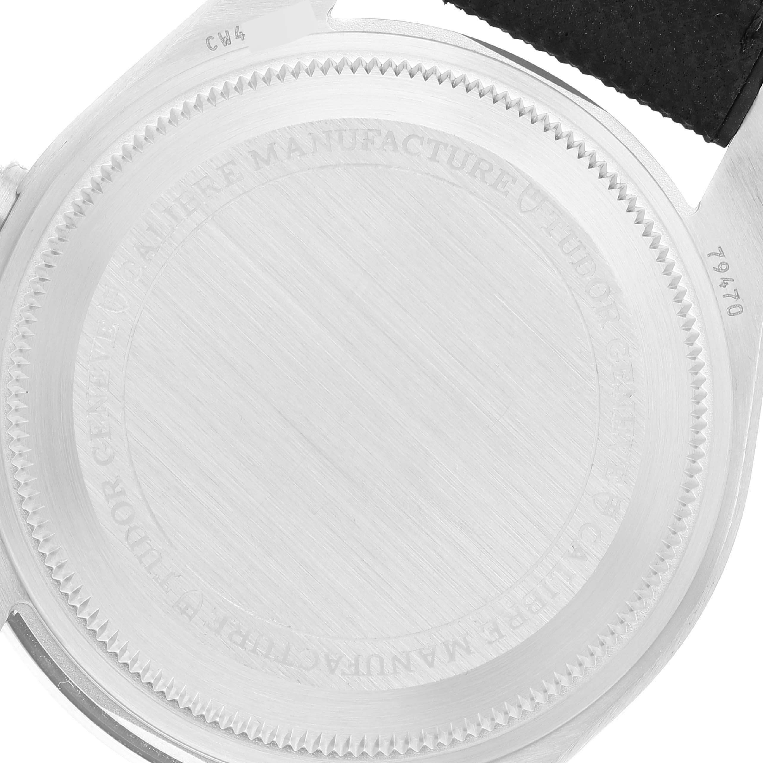 The image shows the backside of a Tudor Heritage Black Bay M79470-0003 Men
s Stainless Steel Black Dial M79470-0003 Men
s Stainless Steel Black Dial watch, highlighting the case back and strap attachment.