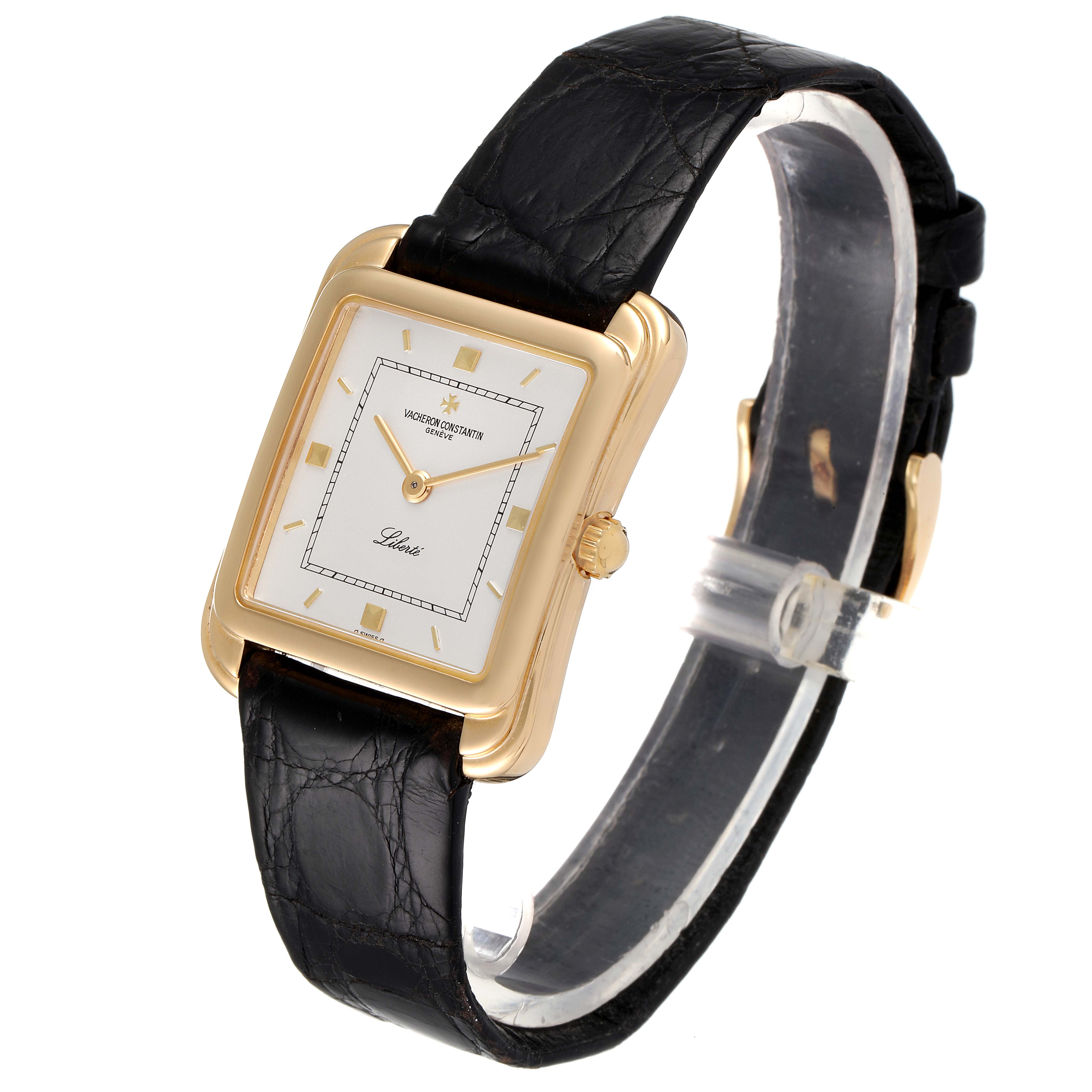 This image shows a Vacheron Constantin Vintage 31100 Men's Yellow Gold Silver Dial 31100 Men's Yellow Gold Silver Dial model watch at an angle showcasing its rectangular dial, gold case, and black leather strap.