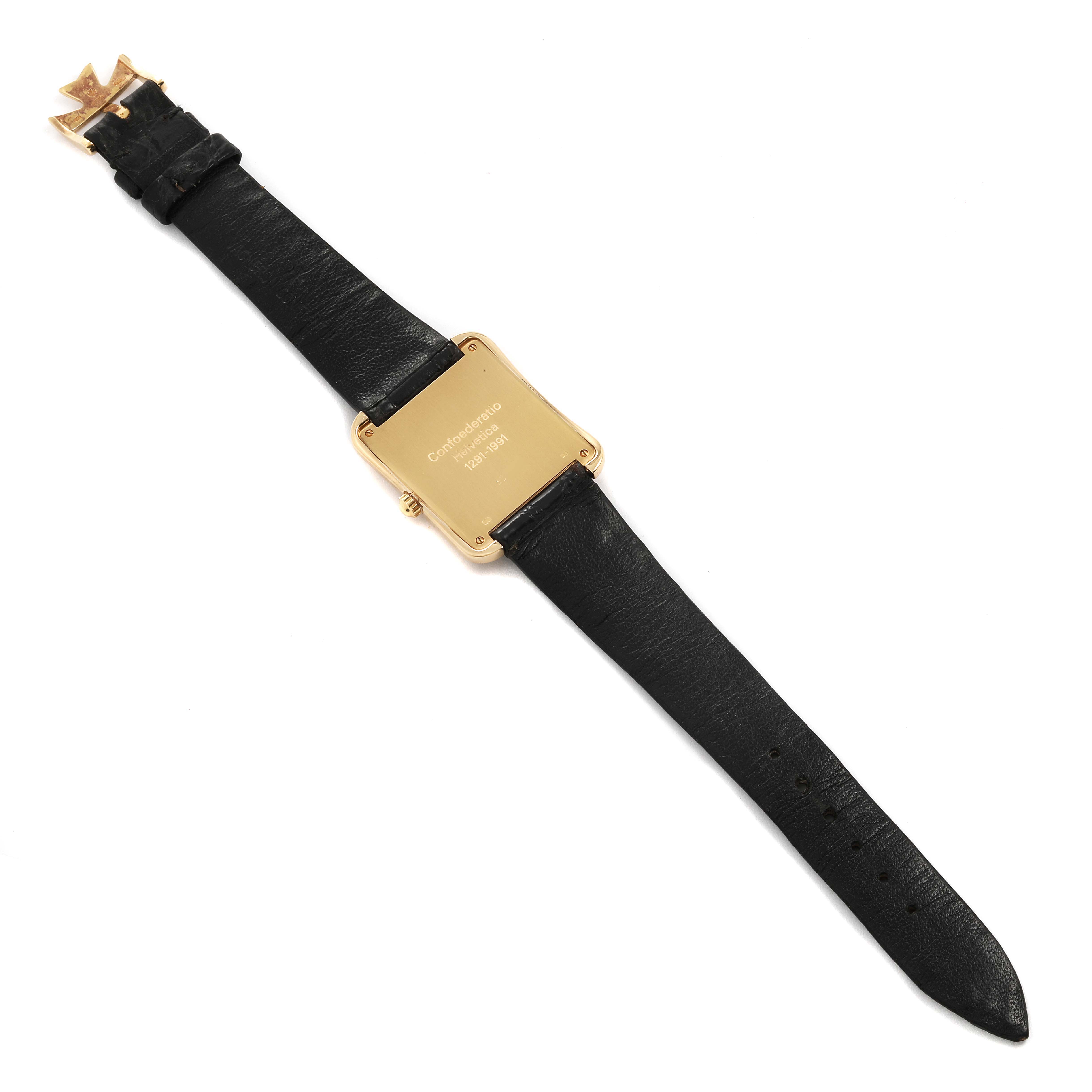 The image shows the back side of a Vintage Vacheron Constantin watch with a black leather strap and gold-tone case back.