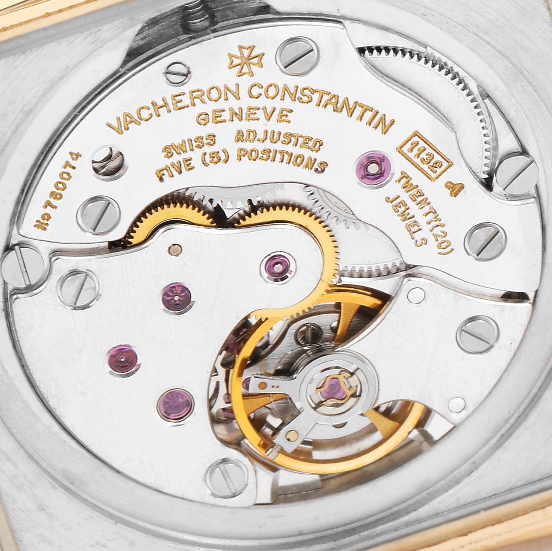 The image shows a close-up, detailed view of the movement of a vintage Vacheron Constantin watch, highlighting gears and jewels.