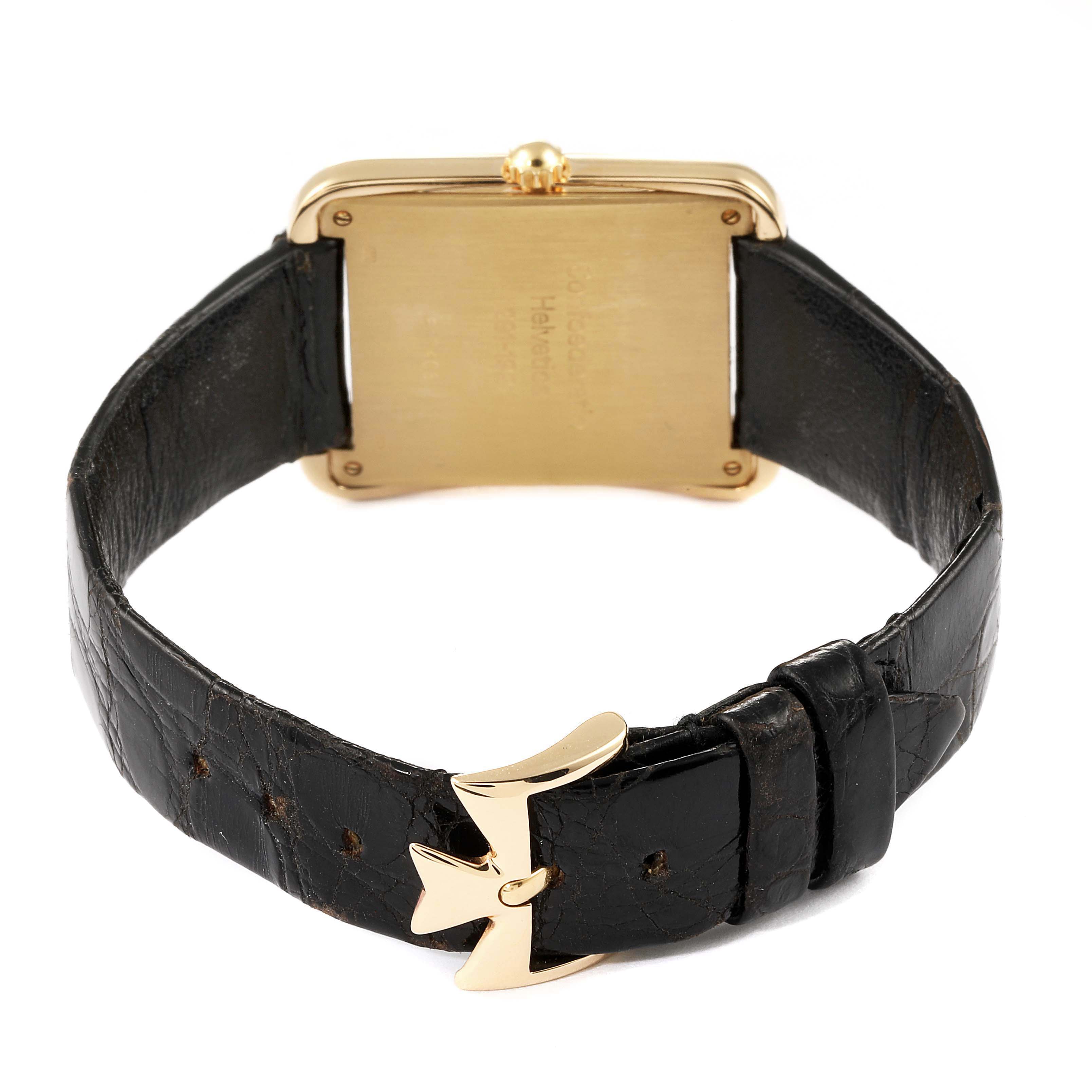 The image shows the backside of the Vintage Vacheron Constantin watch along with its black leather strap and distinctive gold buckle.