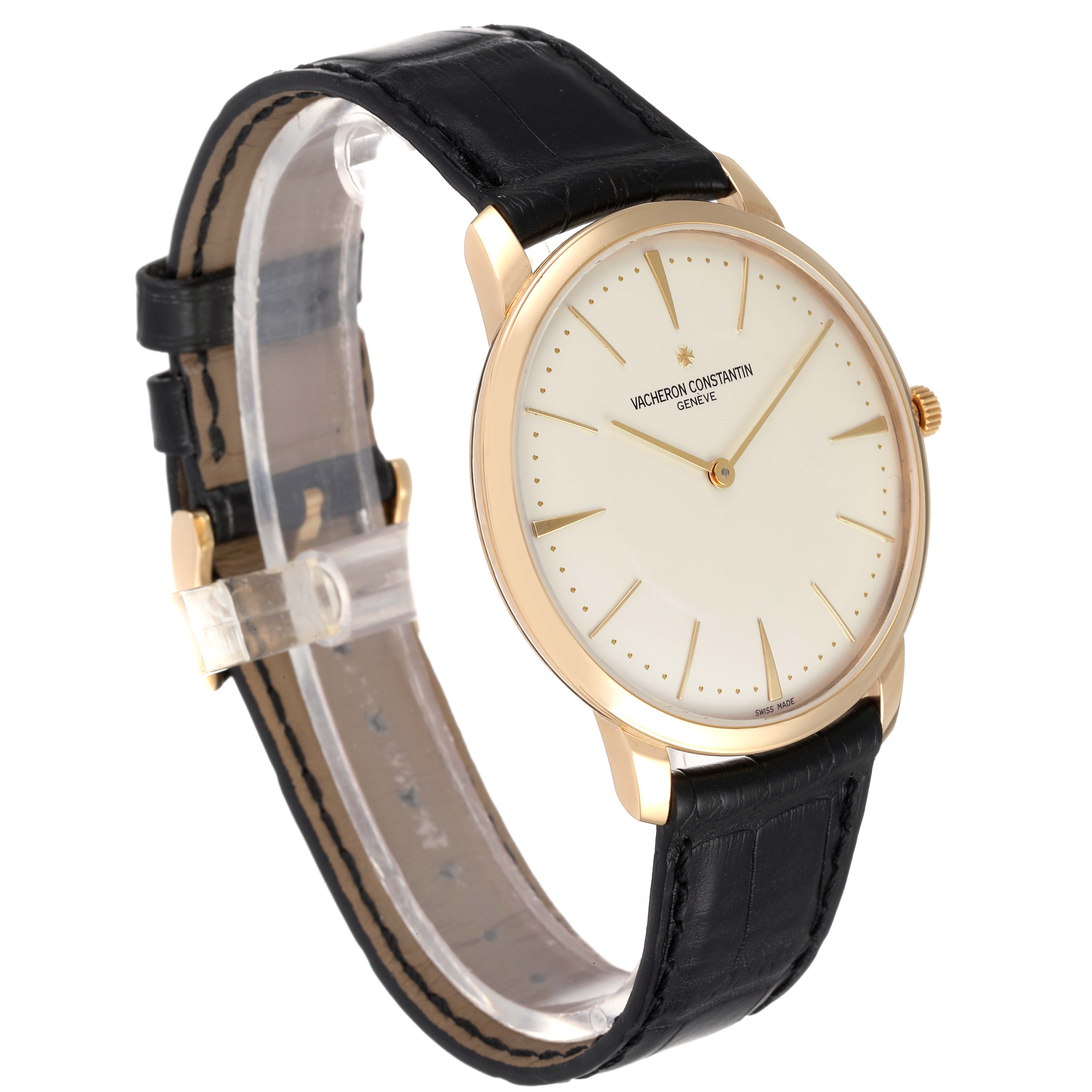 The Vacheron Constantin Patrimony 81180 Men's Yellow Gold Silver Dial 81180 Men's Yellow Gold Silver Dial watch is shown at a slight angle, displaying its face, gold case, and black leather strap.