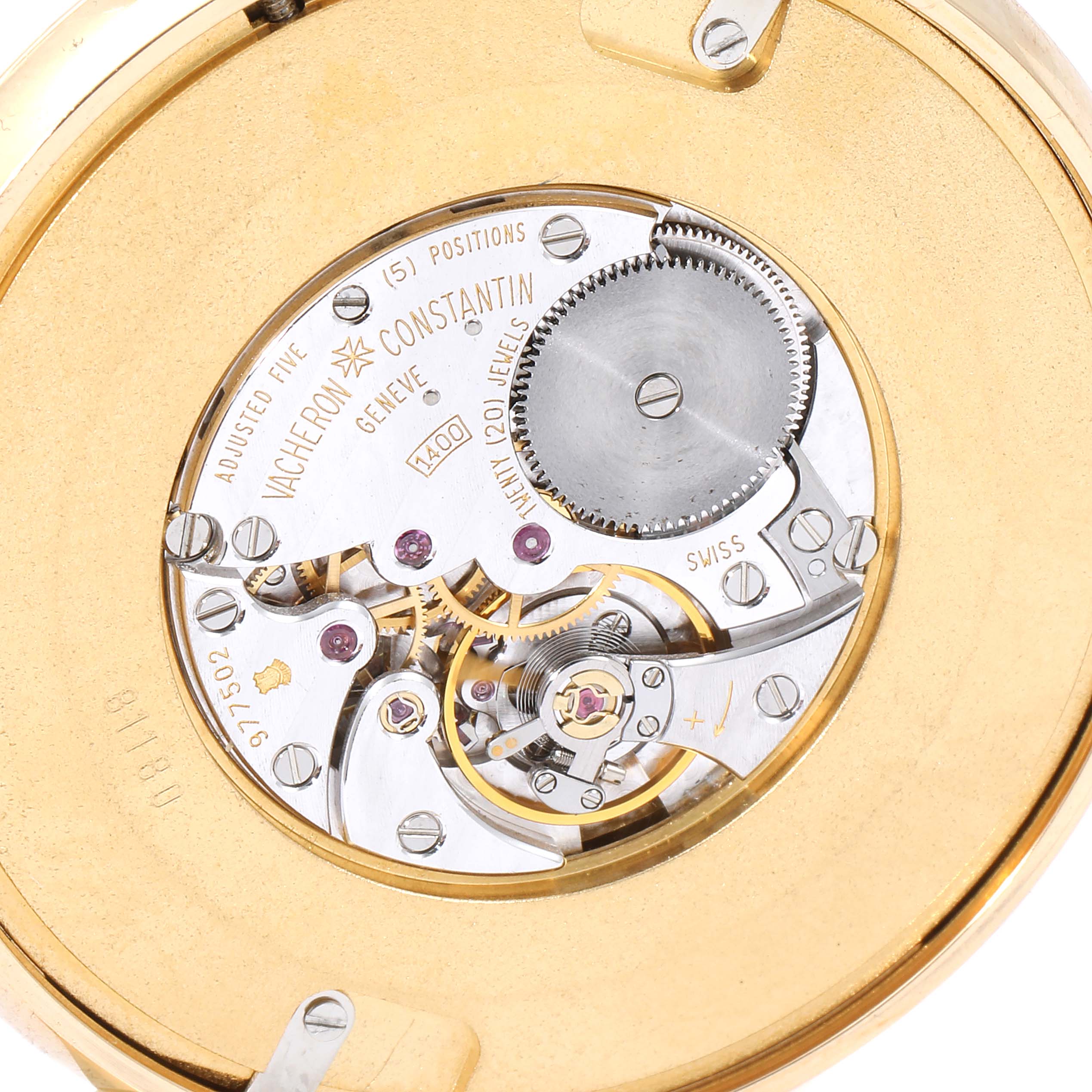 This is a close-up of the movement inside a Vacheron Constantin Patrimony 81180 Men's Yellow Gold Silver Dial 81180 Men's Yellow Gold Silver Dial watch, showing gears and mechanisms.