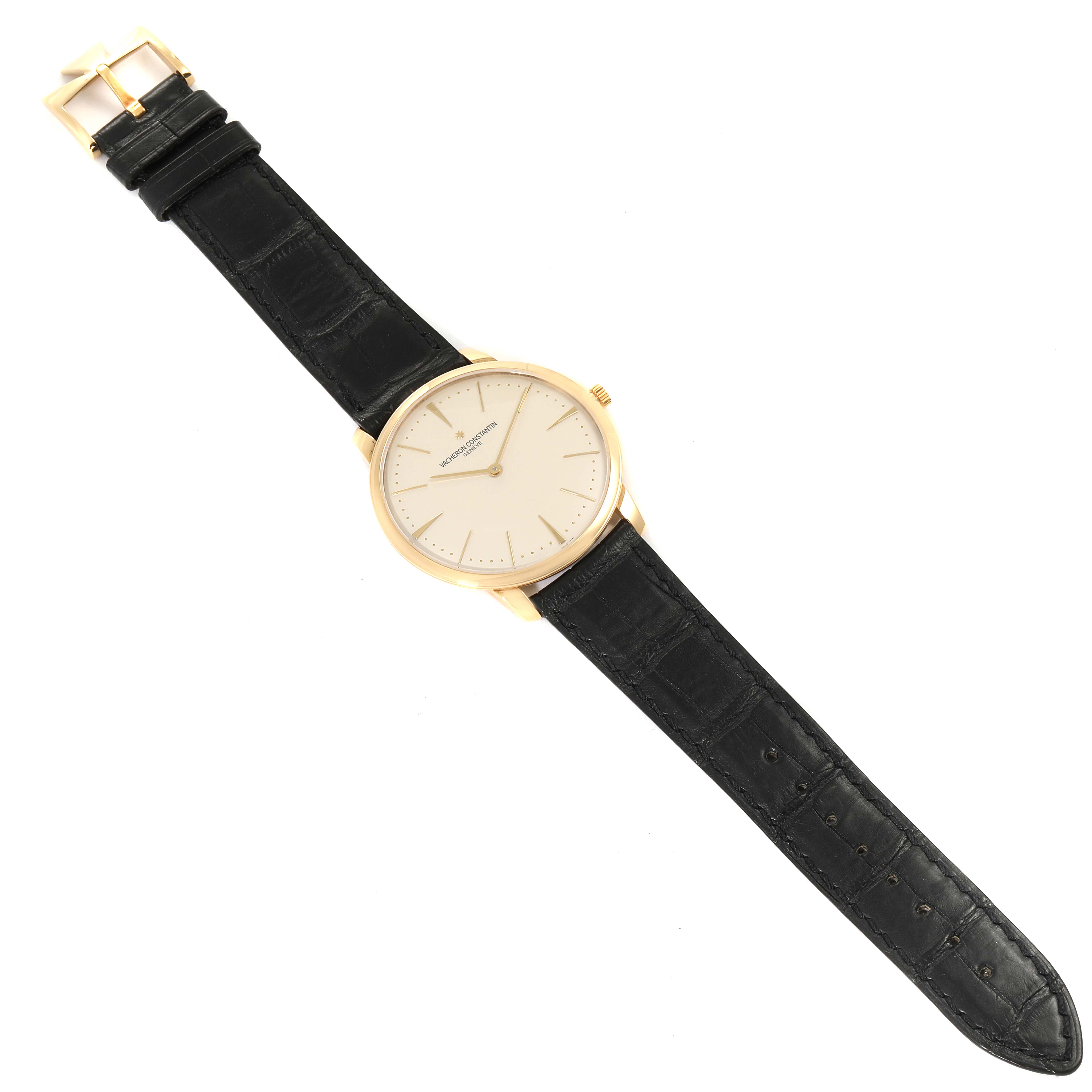 The Vacheron Constantin Patrimony 81180 Men's Yellow Gold Silver Dial 81180 Men's Yellow Gold Silver Dial watch is shown from a top-down angle, displaying its face, gold case, crown, and black leather strap.