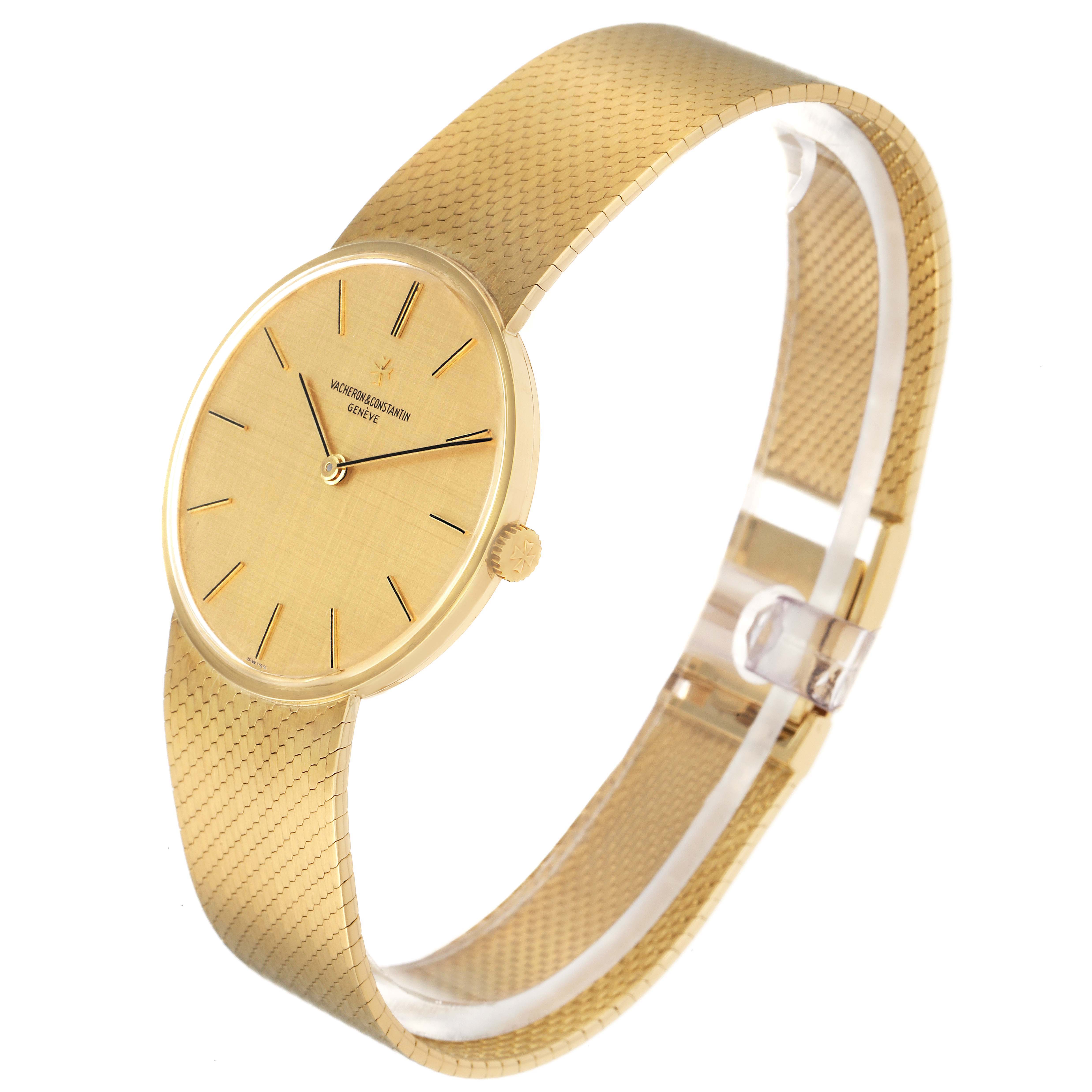 The Vacheron Constantin Vintage model BA31003 watch is shown at a three-quarter angle, highlighting its gold dial, case, and textured bracelet.