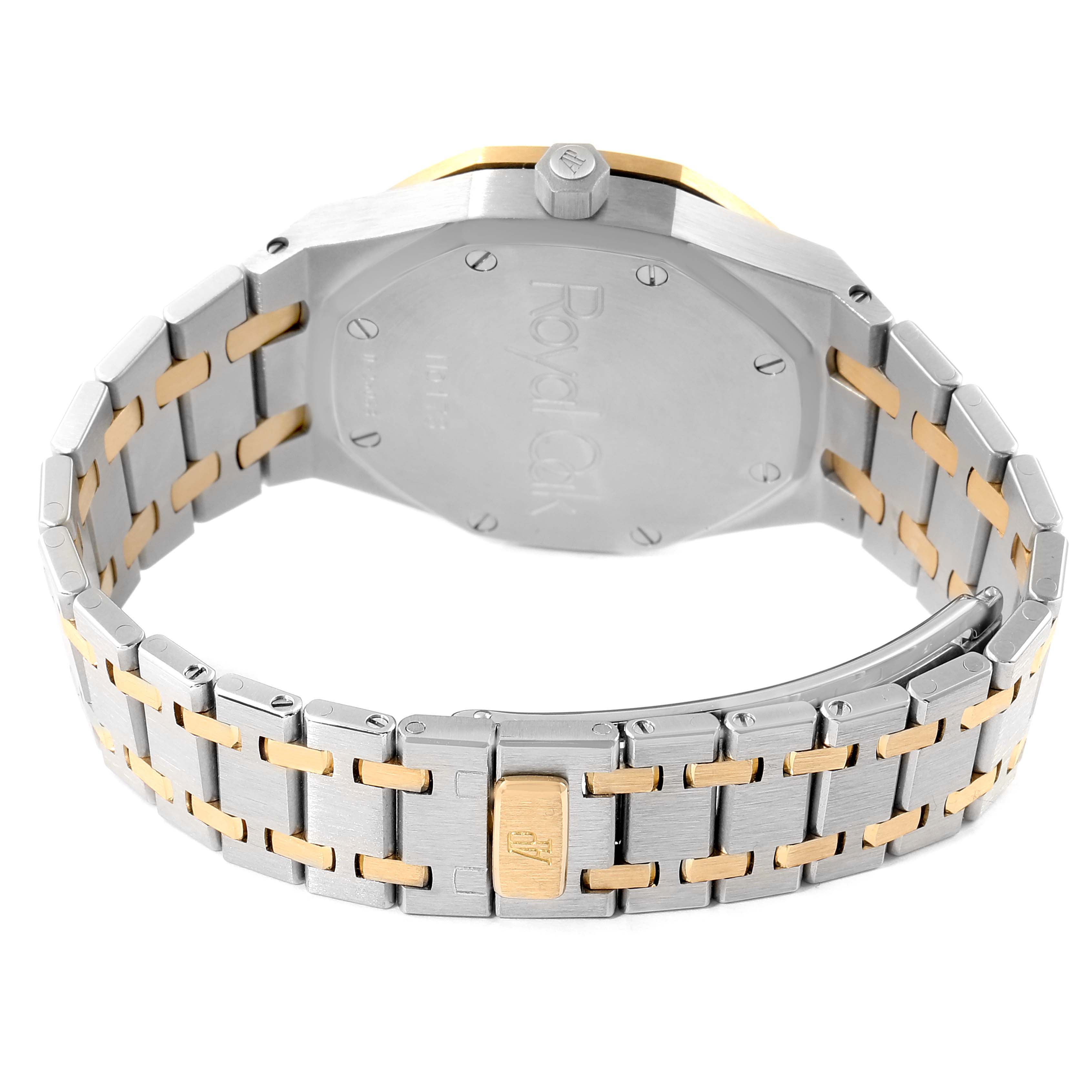 This image shows the back case and bracelet of an Audemars Piguet Royal Oak 25730SA.01.078 Men
s Steel and Gold (two tone) Silver Dial 25730SA.01.078 Men
s Steel and Gold (two tone) Silver Dial watch at an angle.
