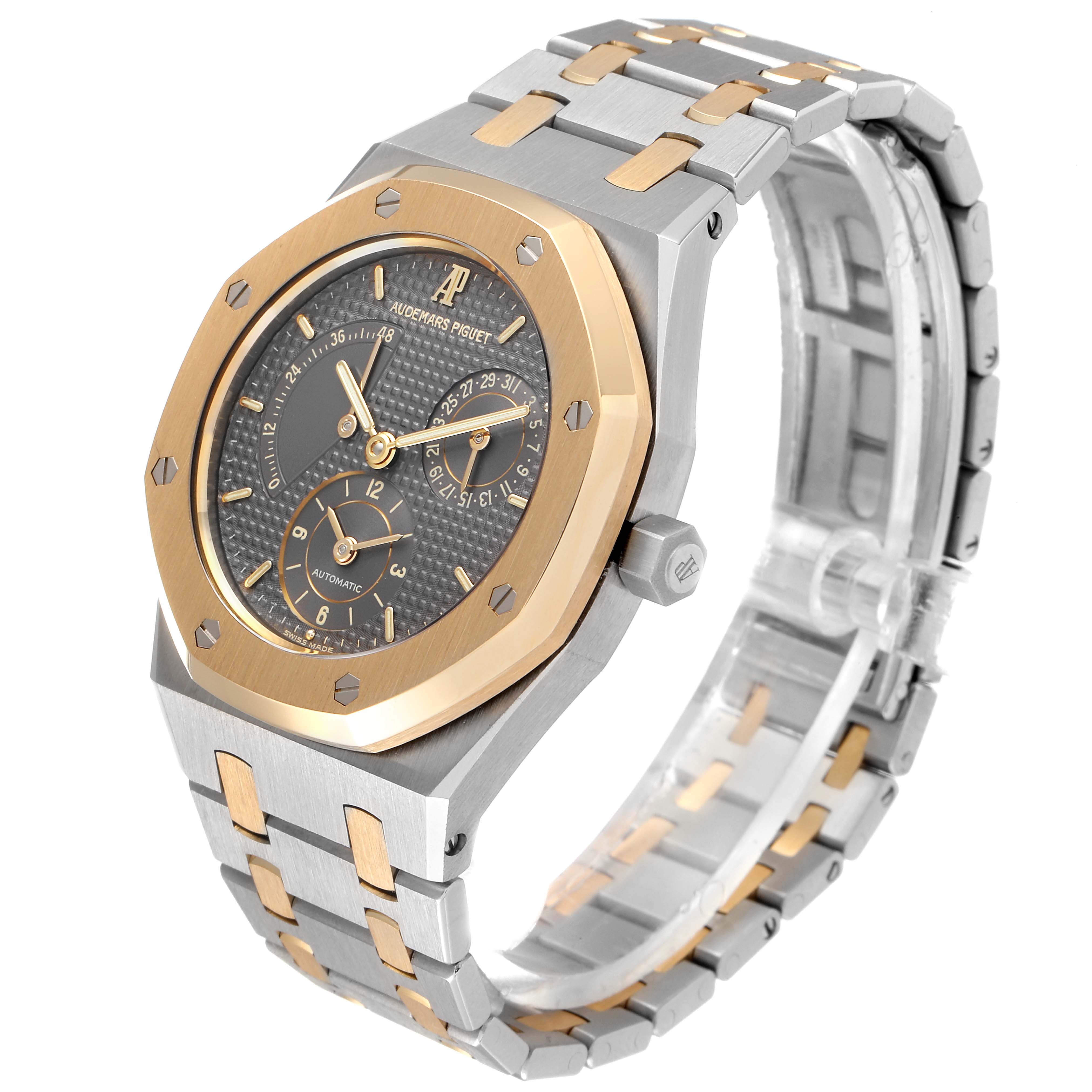 This image shows a side-angle view of the Audemars Piguet Royal Oak 25730SA.01.078 Men
s Steel and Gold (two tone) Silver Dial 25730SA.01.078 Men
s Steel and Gold (two tone) Silver Dial watch, highlighting the face, bezel, and bracelet.