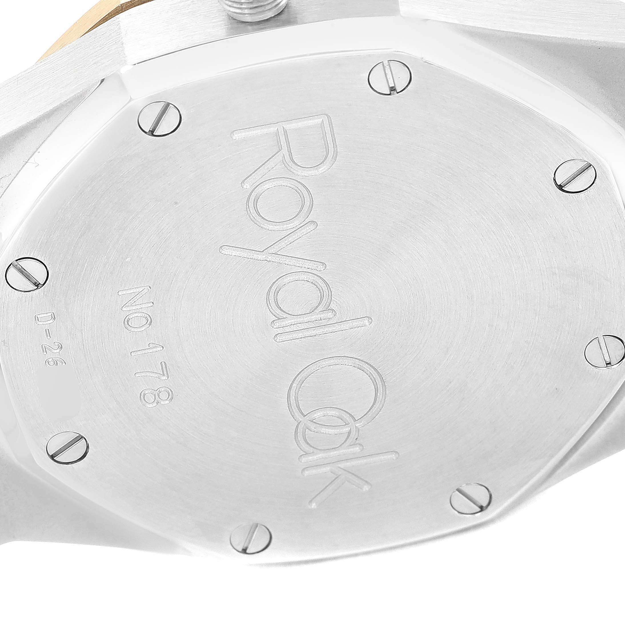The image shows the case back of an Audemars Piguet Royal Oak 25730SA.01.078 Men
s Steel and Gold (two tone) Silver Dial 25730SA.01.078 Men
s Steel and Gold (two tone) Silver Dial watch, with visible screws and engravings.