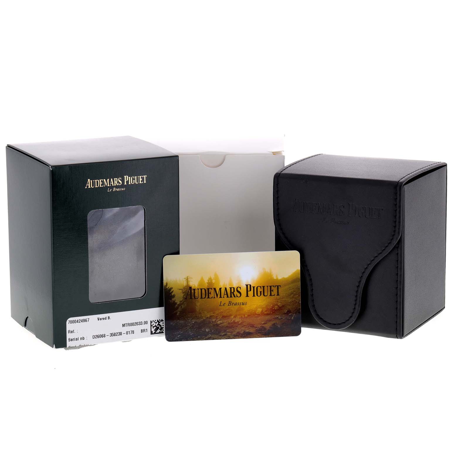 The image shows the box, warranty card, and leather travel case for the Audemars Piguet Royal Oak 25730SA.01.078 Men
s Steel and Gold (two tone) Silver Dial 25730SA.01.078 Men
s Steel and Gold (two tone) Silver Dial watch.