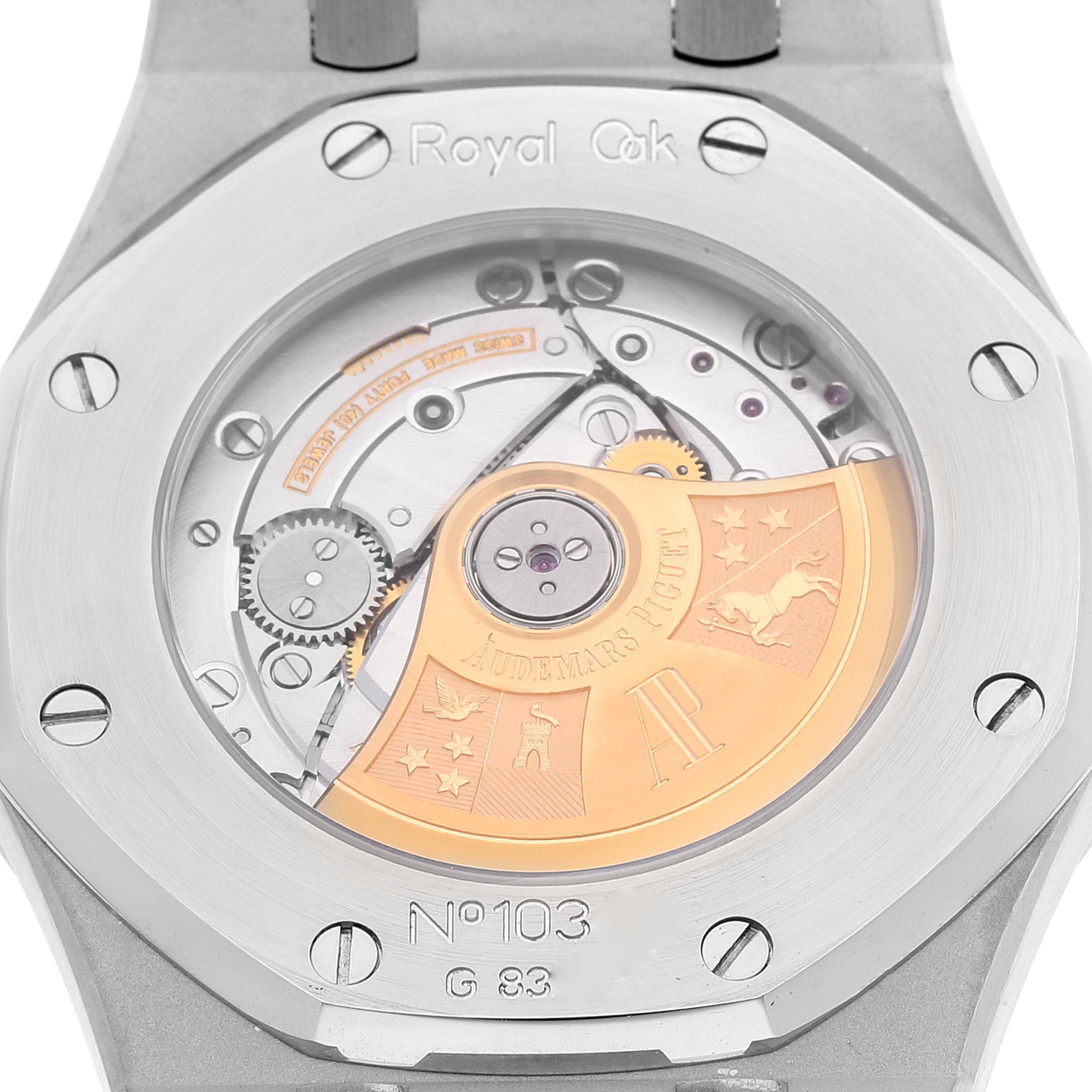 The image shows the back view of the movement mechanism in a Royal Oak watch by Audemars Piguet, displaying its intricate components.