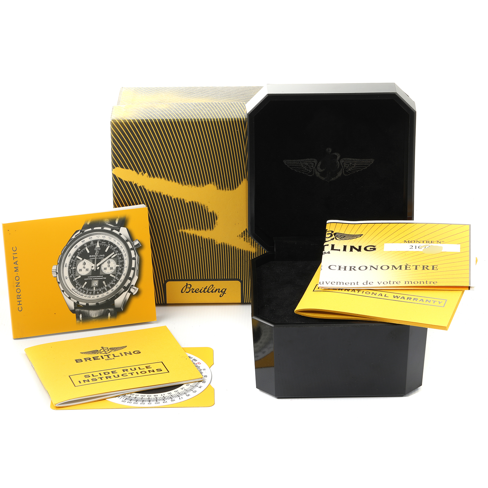 The image shows the packaging, manuals, and warranty card for a Breitling Chronomatic A41360 Men's Stainless Steel Black Dial A41360 Men's Stainless Steel Black Dial watch.