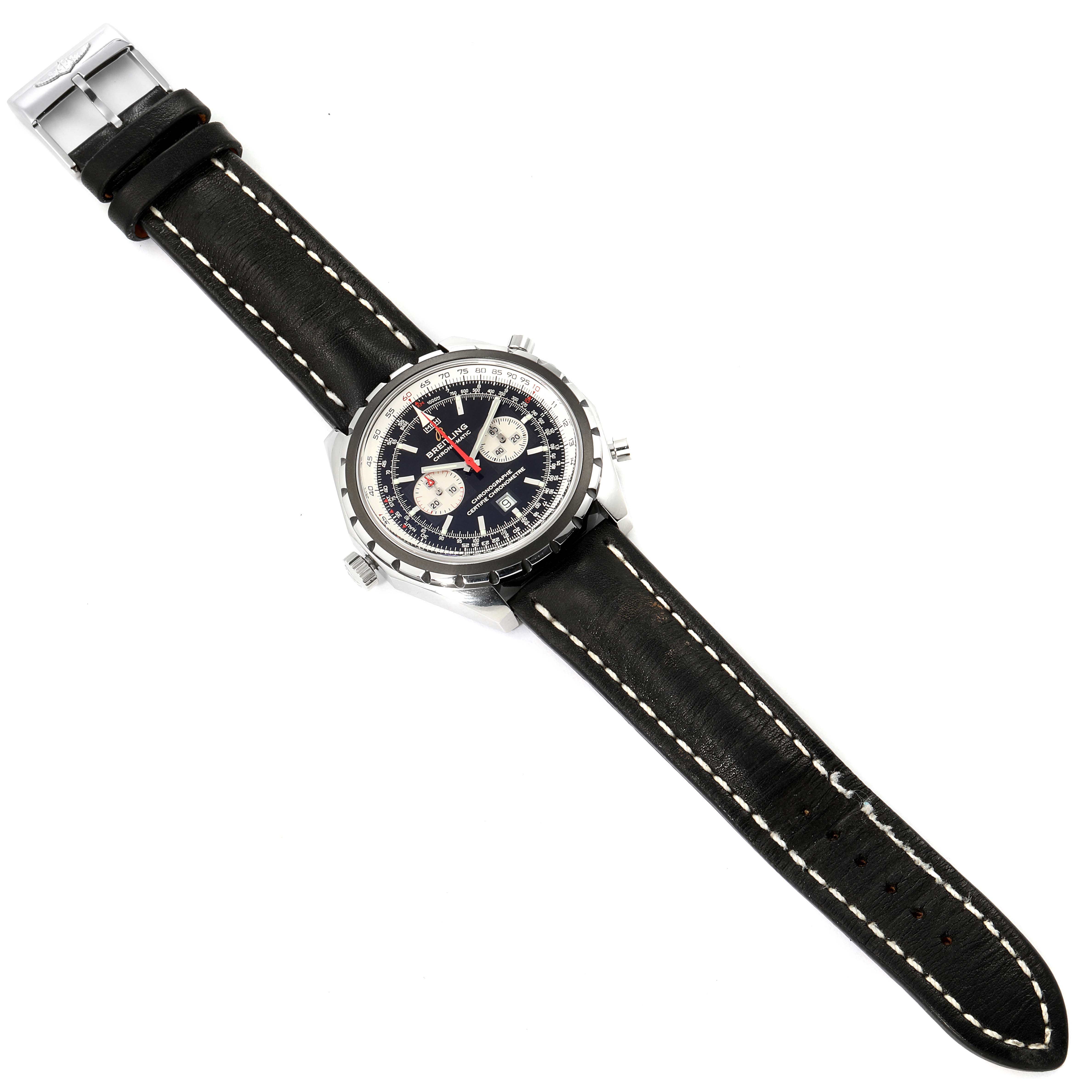 This image shows a Breitling Chronomatic A41360 Men's Stainless Steel Black Dial A41360 Men's Stainless Steel Black Dial watch from a top view, displaying its dial, case, and leather strap.