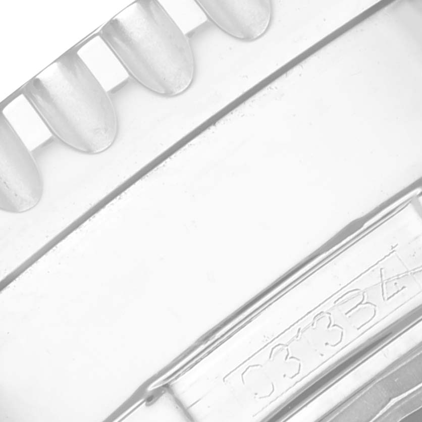 The image shows an up-close view of the bezel and part of the case back of a Breitling Navitimer A24322 Men
s Stainless Steel Black Dial A24322 Men
s Stainless Steel Black Dial watch.