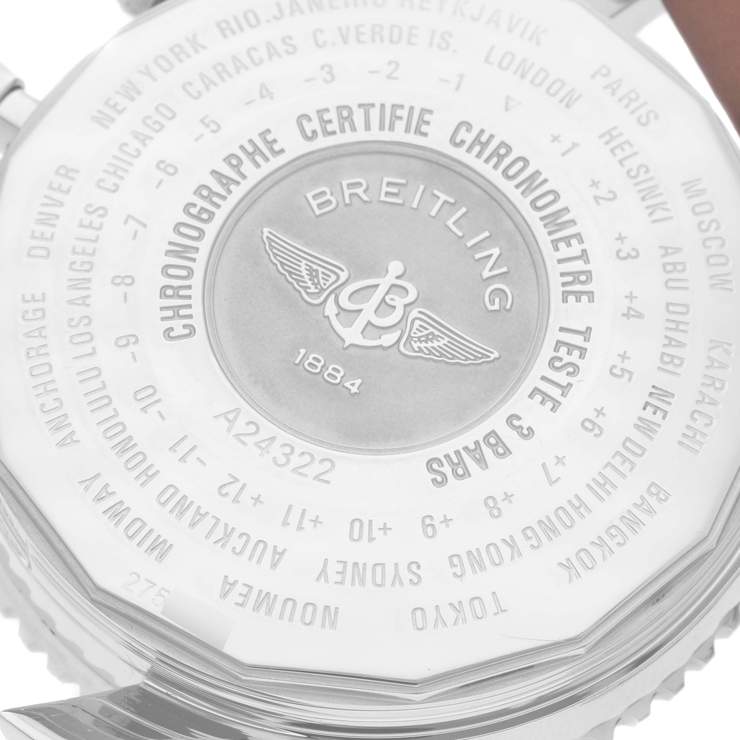 The image shows the engraved back case of a Breitling Navitimer A24322 Men
s Stainless Steel Black Dial A24322 Men
s Stainless Steel Black Dial watch, displaying various global city names and time zones.