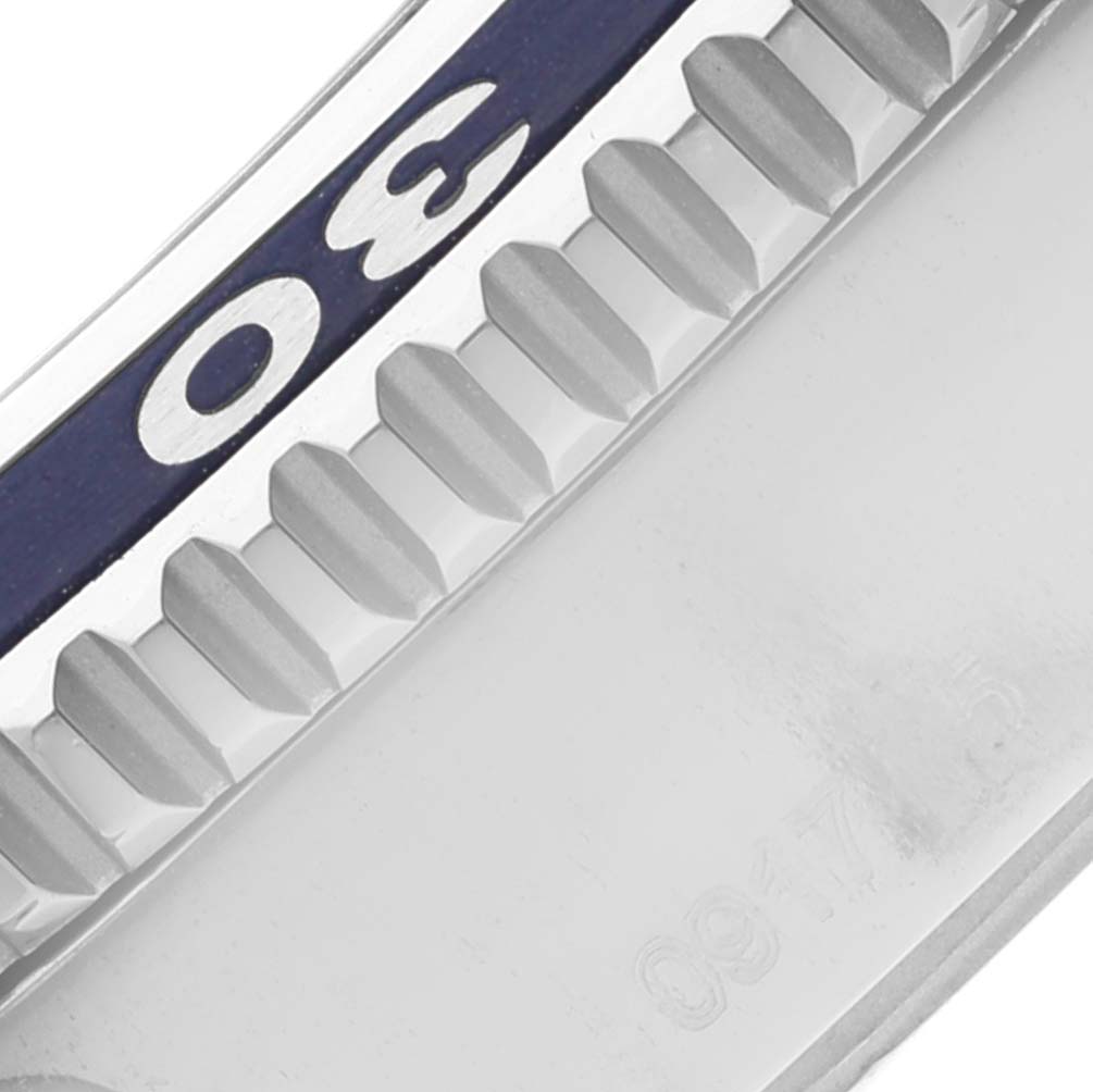 This close-up of a Breitling Superocean A17365 Men's Stainless Steel Blue Dial A17365 Men's Stainless Steel Blue Dial watch shows the edge of the bezel with the number "30" and part of the case.