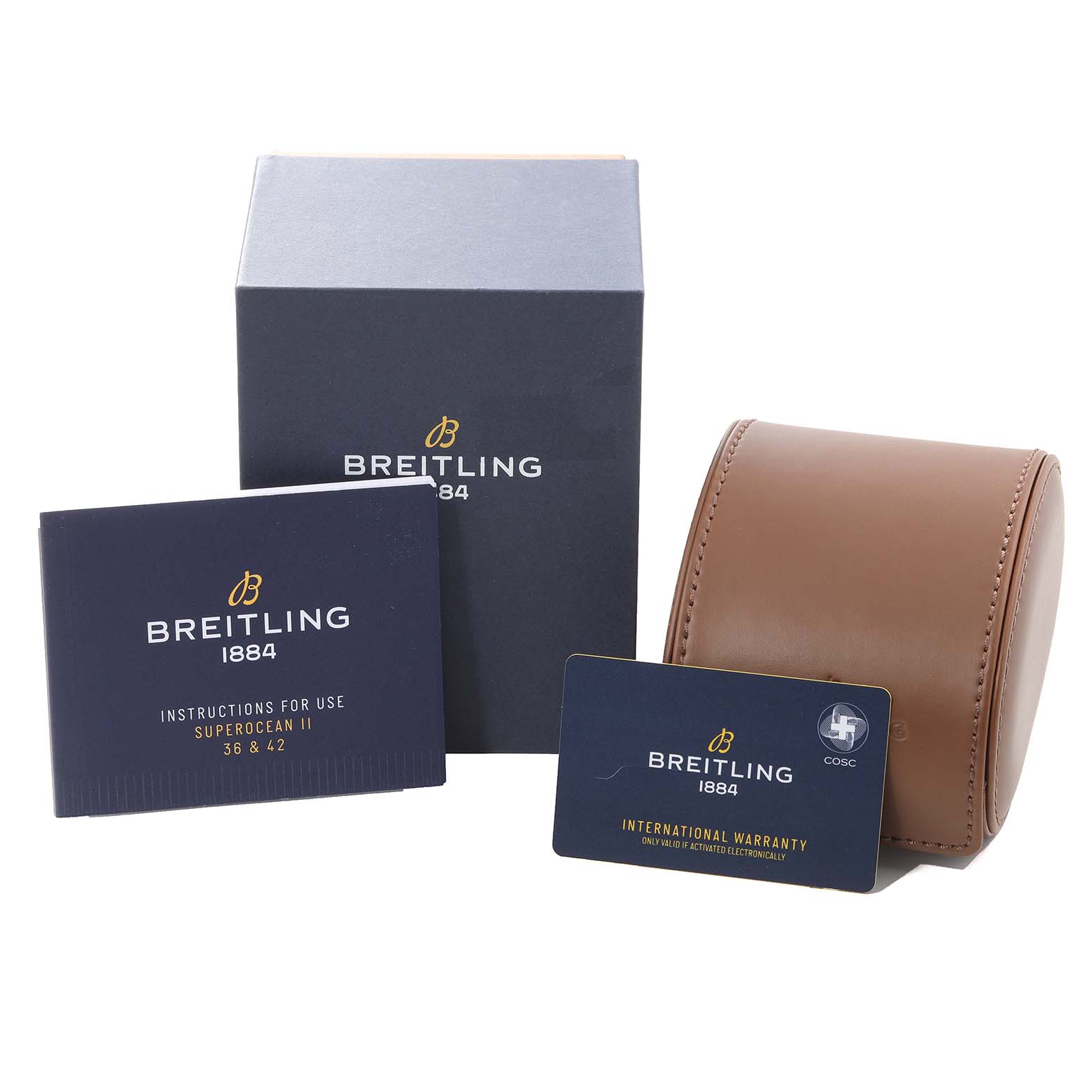 The image shows Breitling Superocean A17365 Men's Stainless Steel Blue Dial A17365 Men's Stainless Steel Blue Dial packaging including a box, manual, warranty card, and leather travel case.