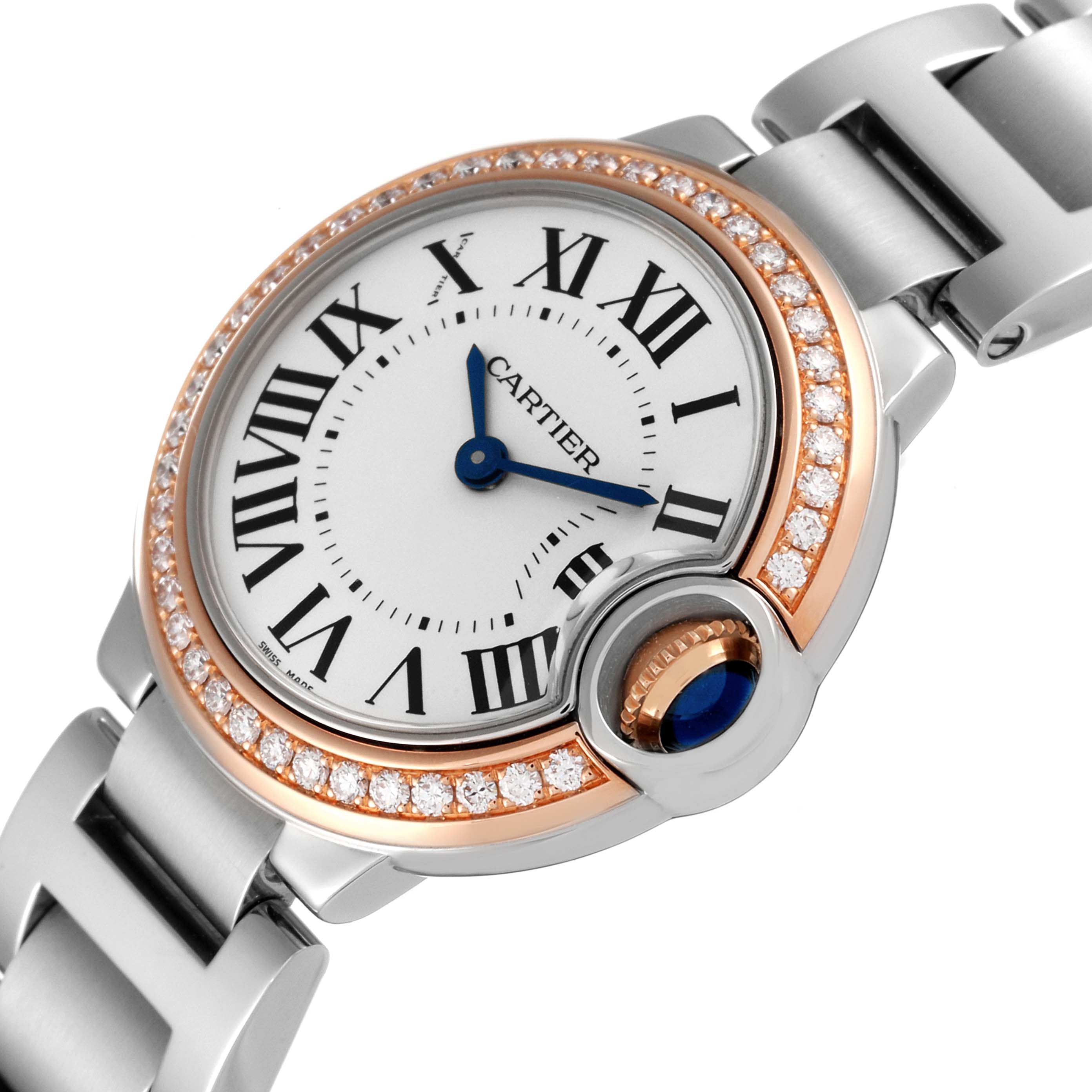 The image shows a close-up angle of a Cartier Ballon Bleu WE902079 Women's Steel and Gold (two tone) Silver Dial WE902079 Women's Steel and Gold (two tone) Silver Dial watch highlighting its face, diamond bezel, and part of the metal bracelet.