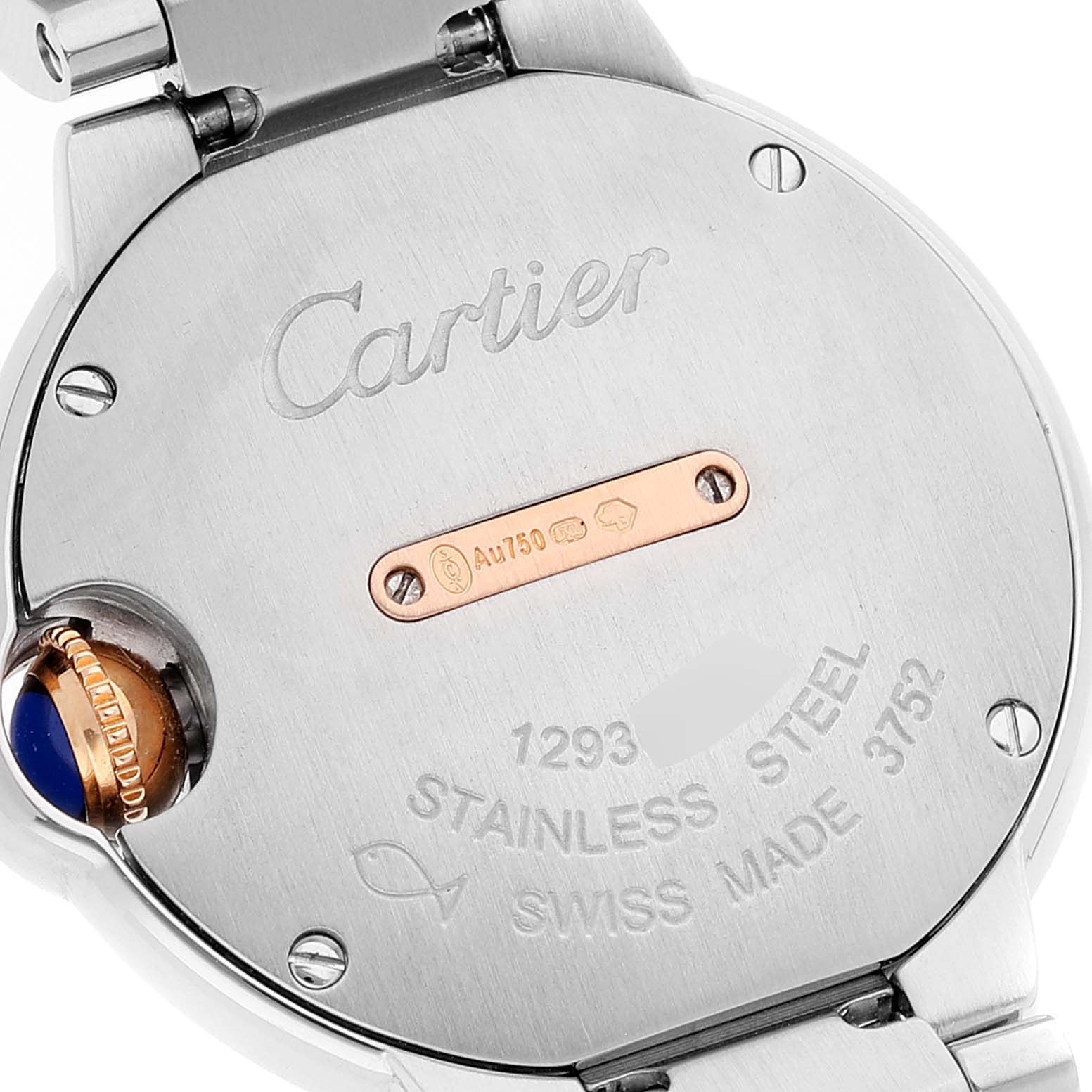 This image shows the back case of a Cartier Ballon Bleu WE902079 Women's Steel and Gold (two tone) Silver Dial WE902079 Women's Steel and Gold (two tone) Silver Dial watch, including engraving and a visible crown decorated with a blue cabochon.