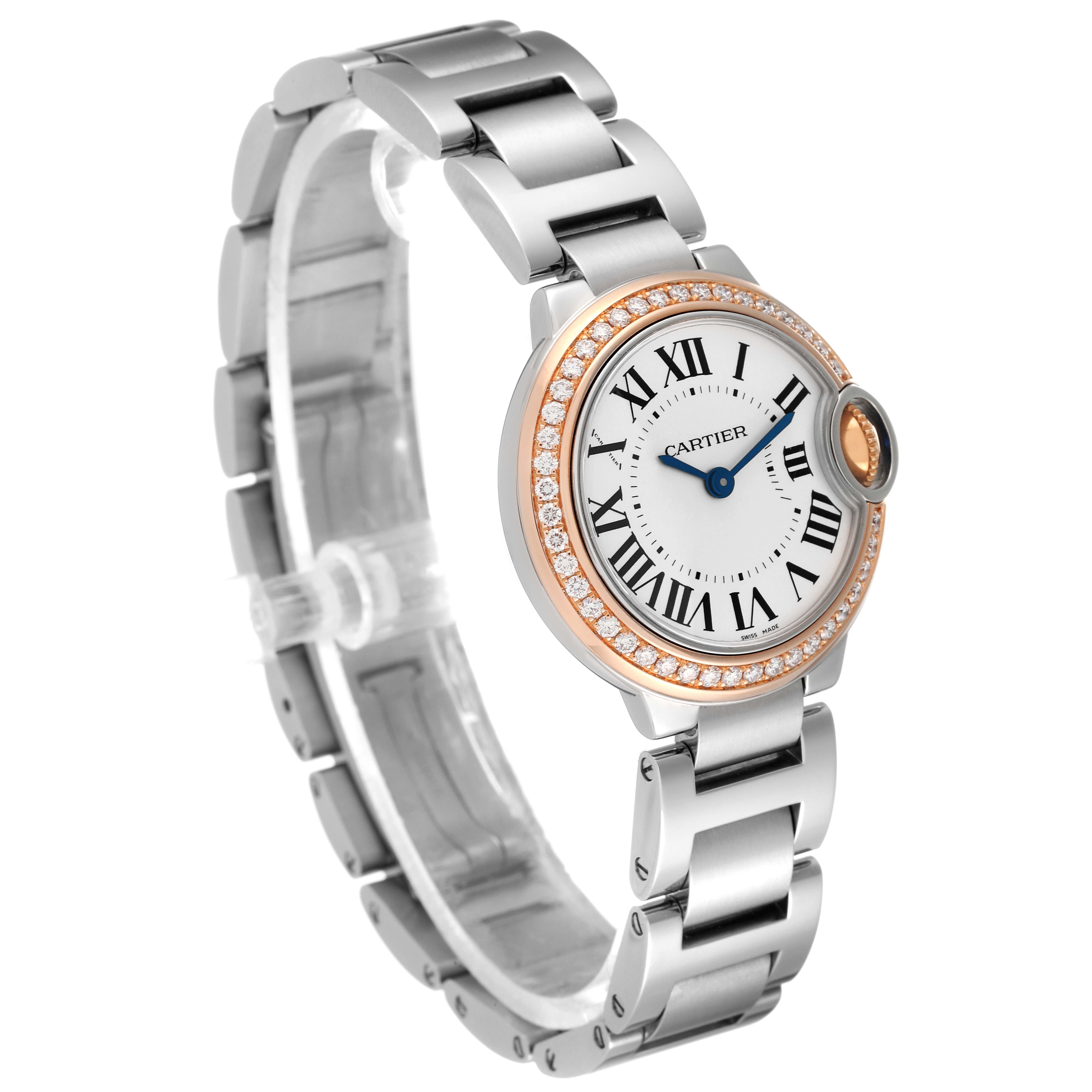 The image shows a Ballon Bleu by Cartier from a front-side angle, highlighting its face, bezel, and metallic bracelet.