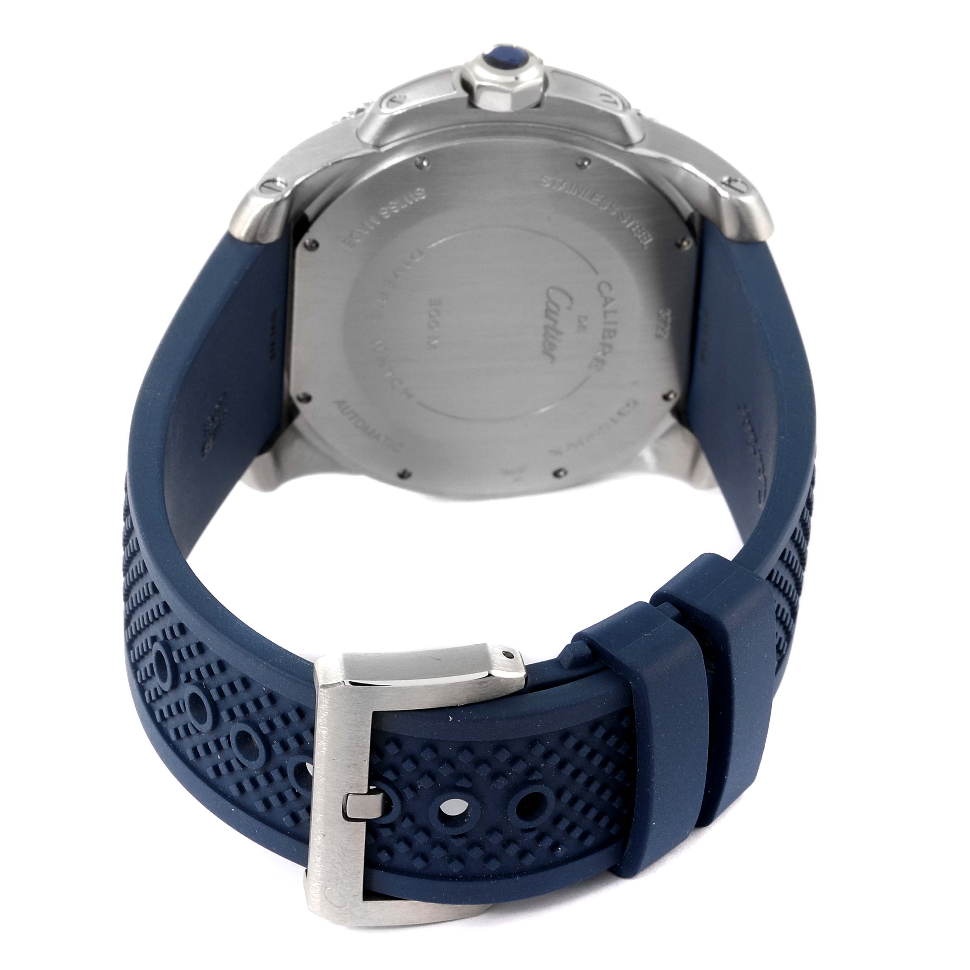 The image shows the back and the clasp of a Calibre de Cartier watch by Cartier at an angled rear view.