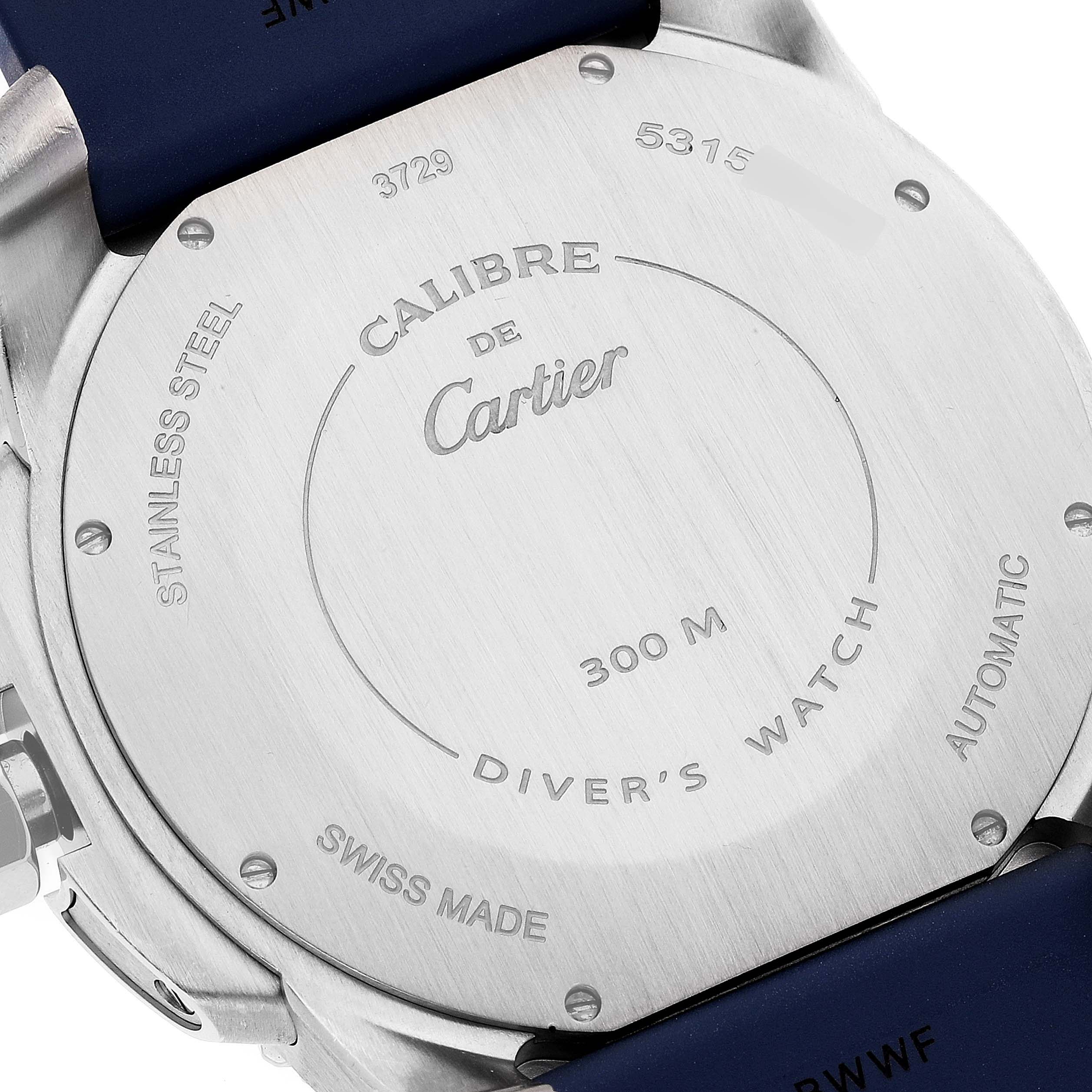The image shows the back case of a Calibre de Cartier watch by Cartier, highlighting its stainless steel and "300 M Diver's Watch" markings.