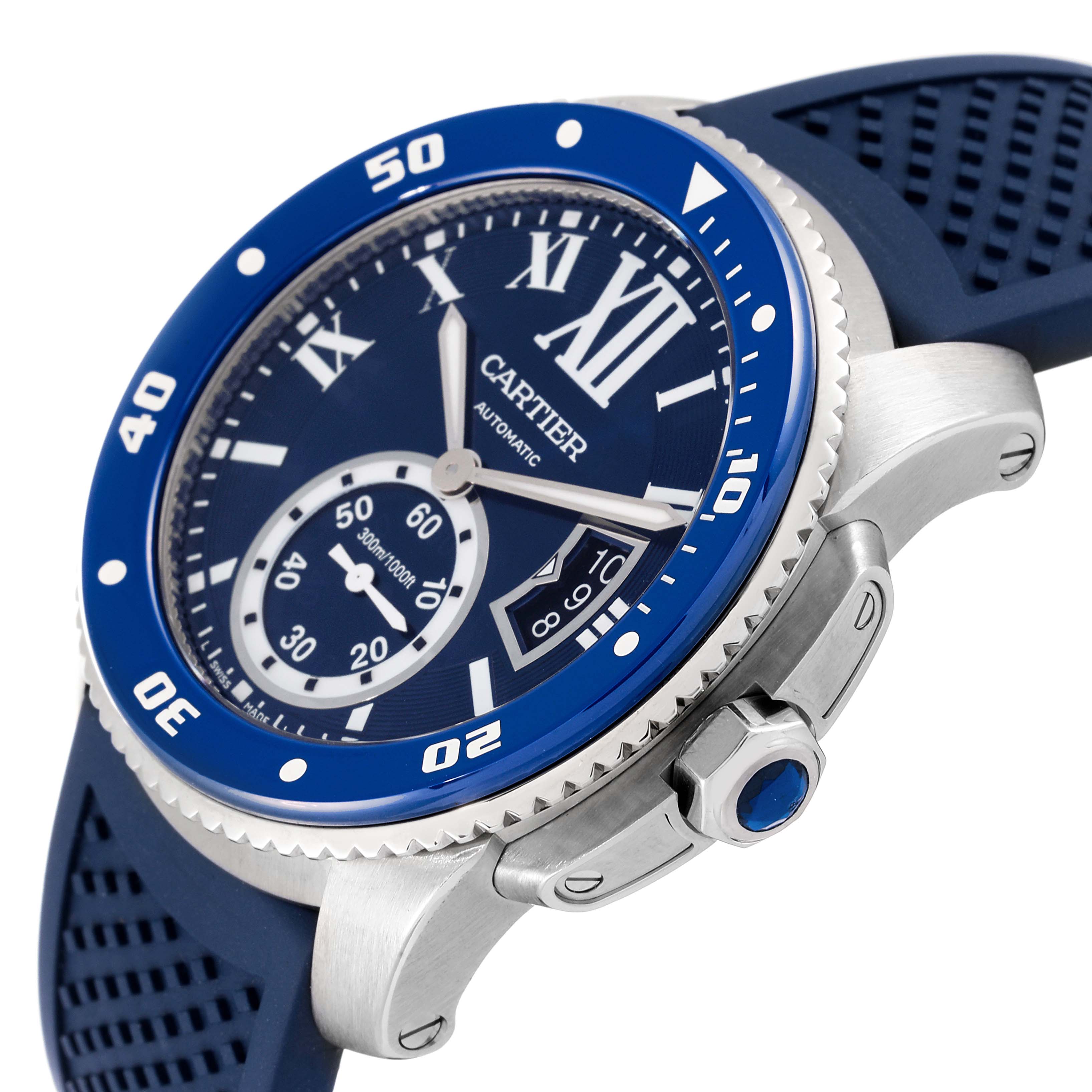 This image shows a close-up angle of the face and bezel of the Calibre de Cartier model by Cartier, highlighting the crown and part of the strap.