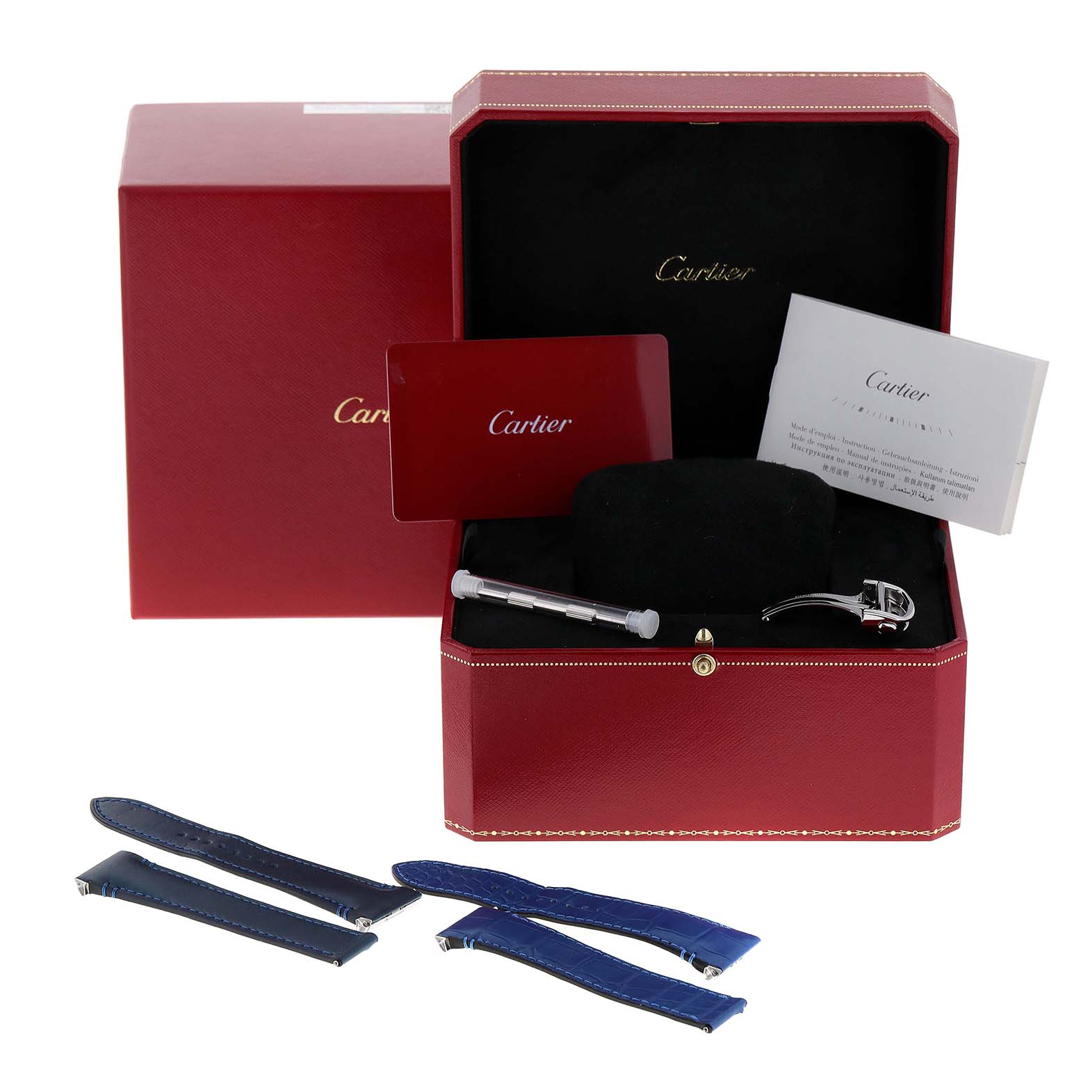 This image shows the box and accessories for a Cartier Santos WSSA0030 Men
s Stainless Steel Blue Dial WSSA0030 Men
s Stainless Steel Blue Dial watch, including straps, a screwdriver, and documentation.