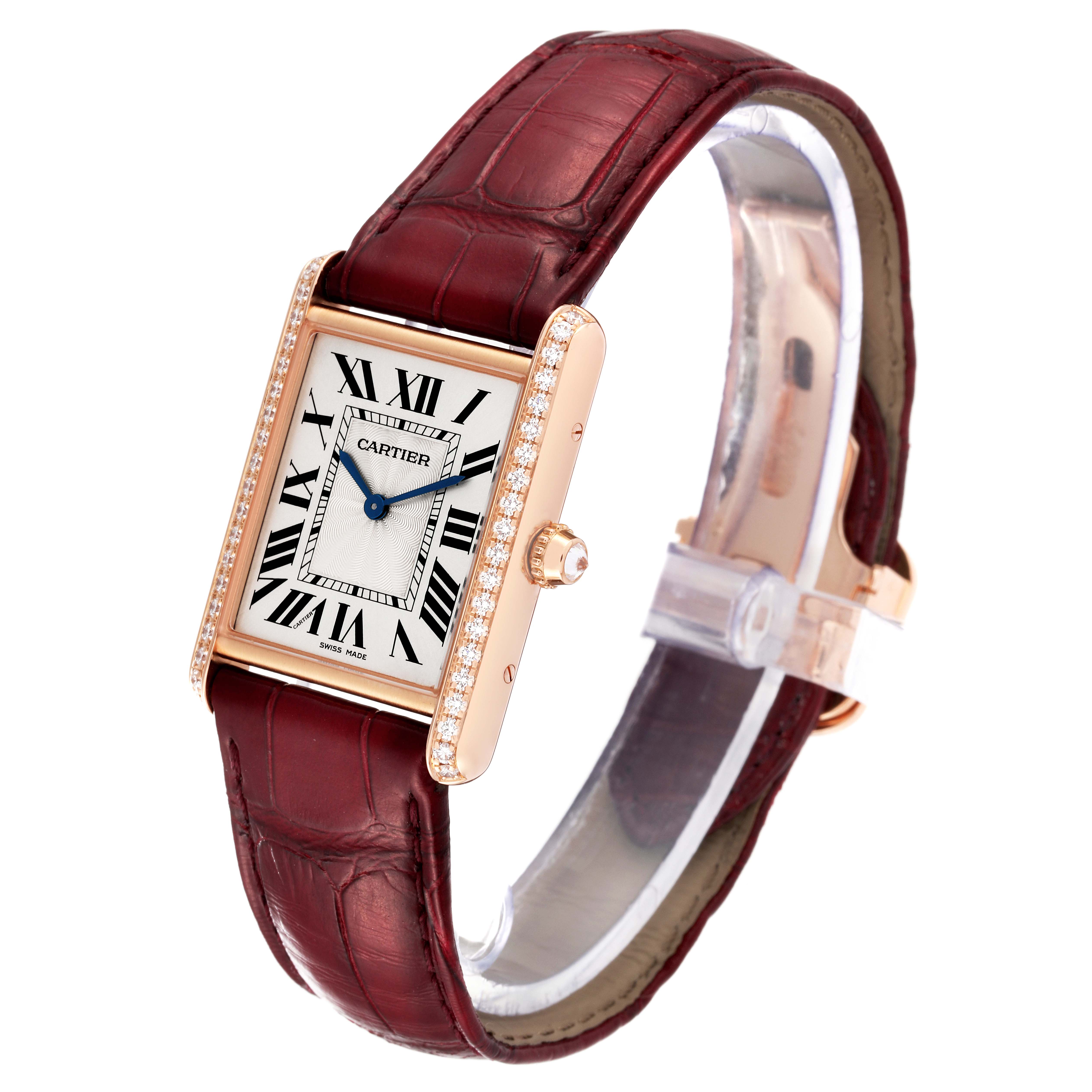 This image shows a Cartier Tank Louis WJTA0014 Women's Yellow Gold Silver Dial WJTA0014 Women's Yellow Gold Silver Dial watch at a 3/4 angle, highlighting its face, crown, and burgundy leather strap.