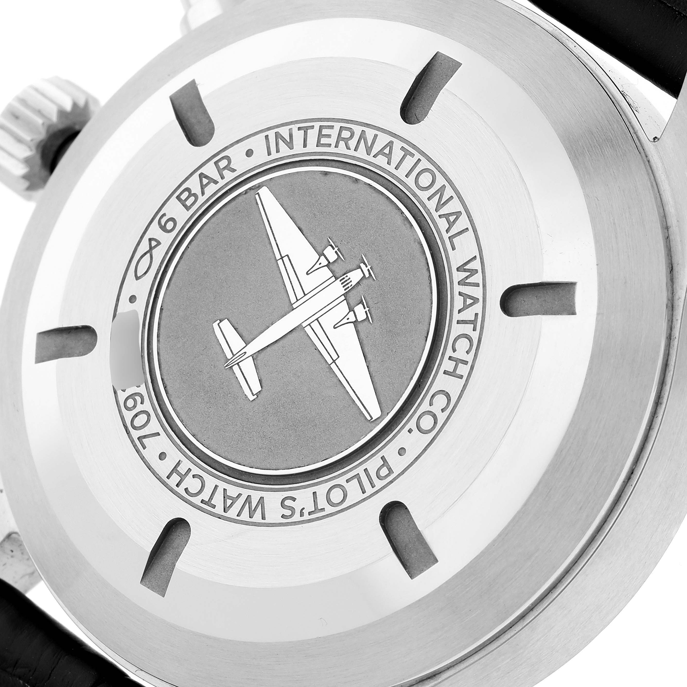 The image shows the back case of the IWC Pilot IW377709 Men's Stainless Steel Black Dial IW377709 Men's Stainless Steel Black Dial model watch, featuring an engraved airplane and brand details.