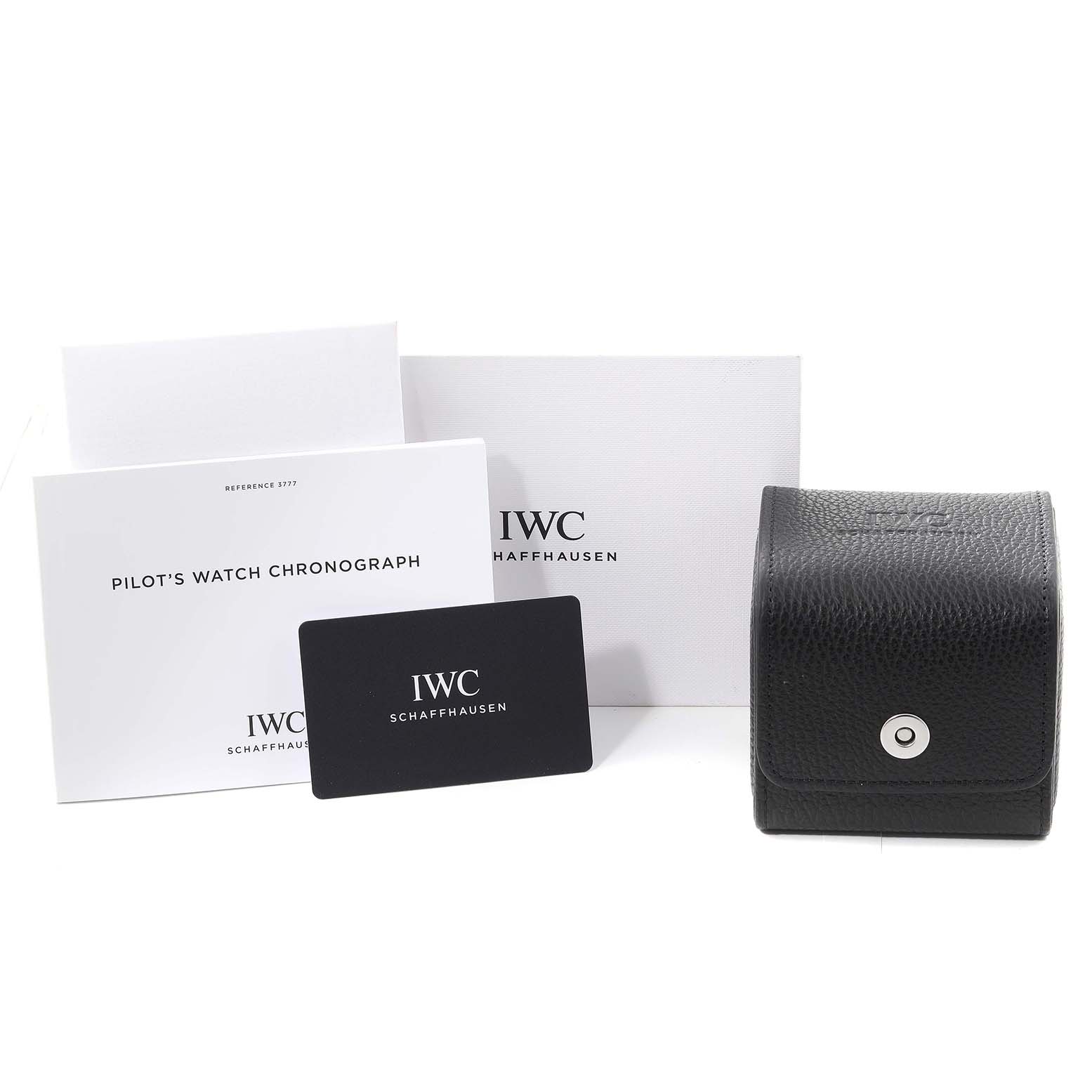 The image shows the packaging, certificates, and a black leather case for an IWC Pilot IW377709 Men's Stainless Steel Black Dial IW377709 Men's Stainless Steel Black Dial's Watch model.