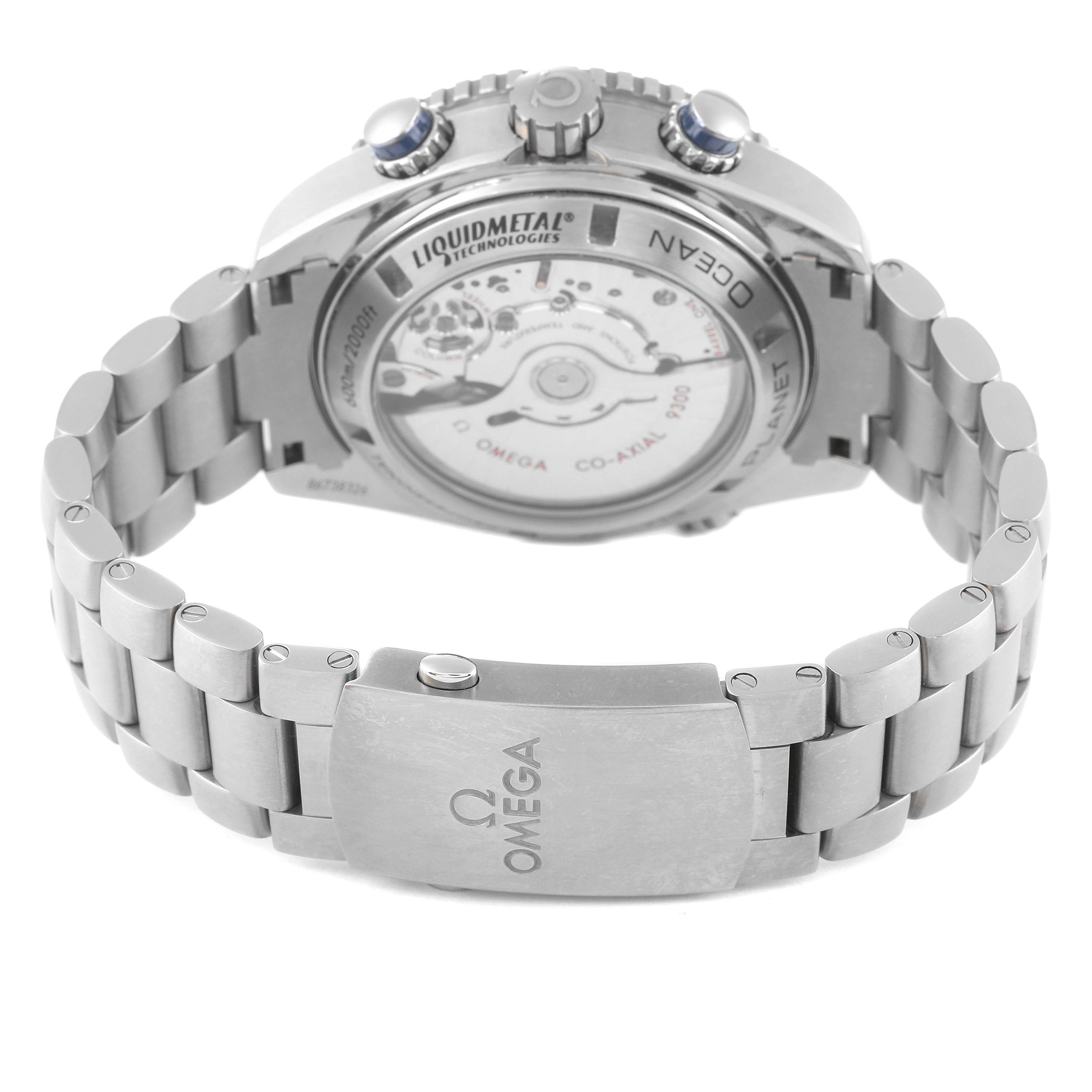 The image shows the back case, bracelet, and clasp of the Omega Planet Ocean 232.90.46.51.03.001 Men's Stainless Steel Blue Dial 232.90.46.51.03.001 Men's Stainless Steel Blue Dial watch, highlighting its mechanism and markings.