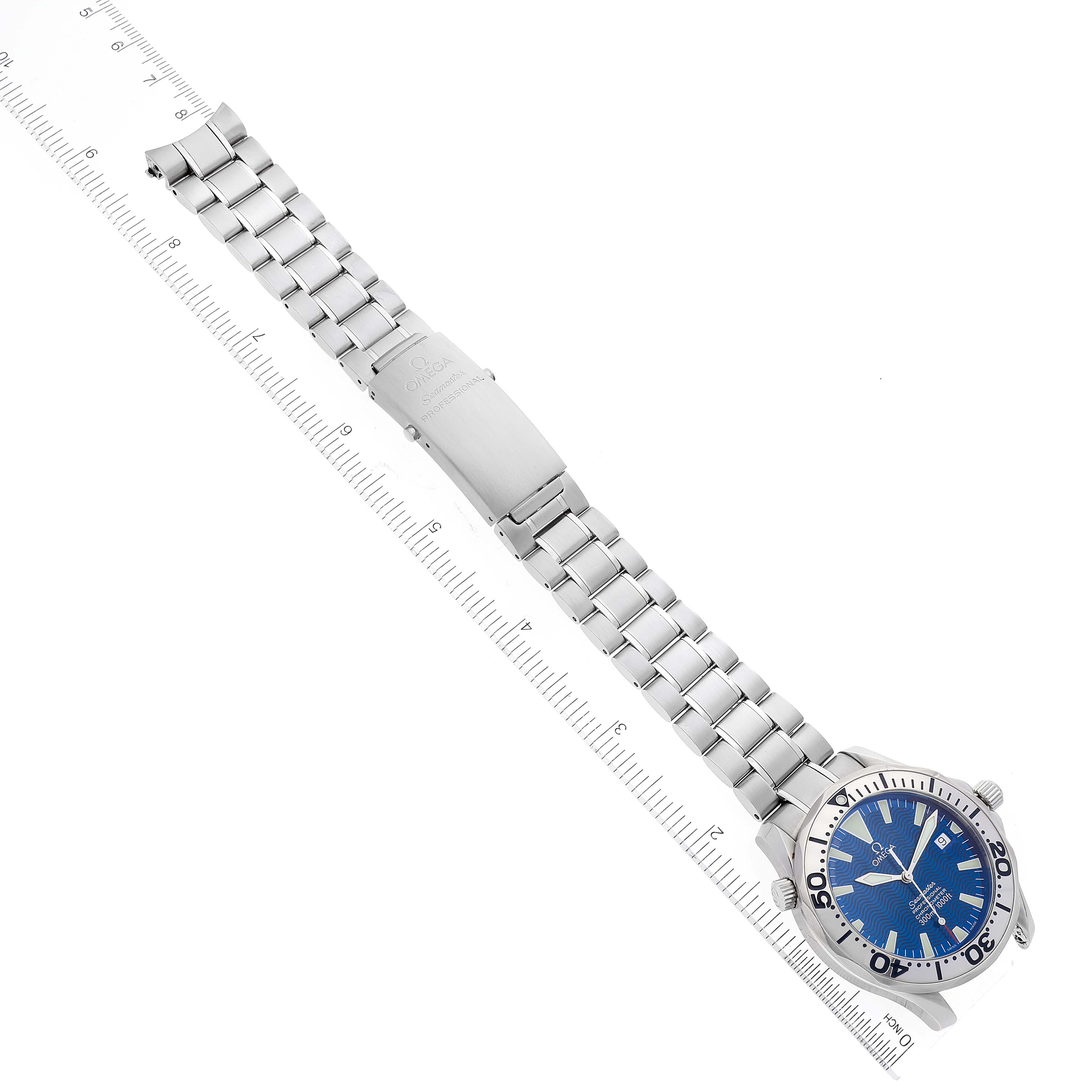 The image shows an Omega Seamaster 2255.80.00 Men's Stainless Steel Blue Dial 2255.80.00 Men's Stainless Steel Blue Dial watch laid flat with a full view of its bracelet, clasp, and dial, alongside a ruler for scale.
