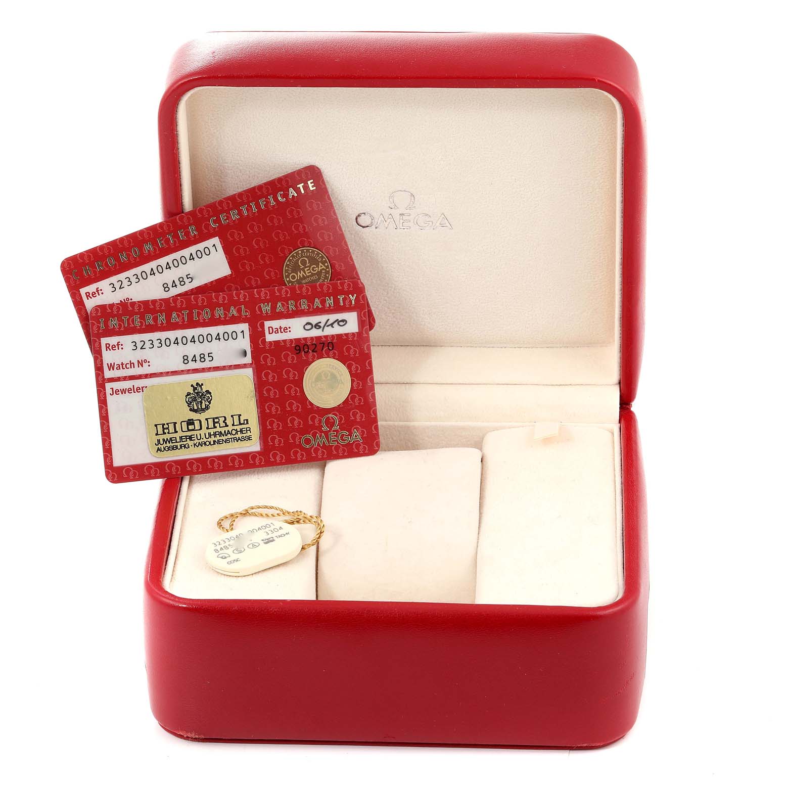 The image shows the open box of an Omega Speedmaster 323.30.40.40.04.001 Men's Stainless Steel White Dial 323.30.40.40.04.001 Men's Stainless Steel White Dial, along with the warranty and certificate cards.