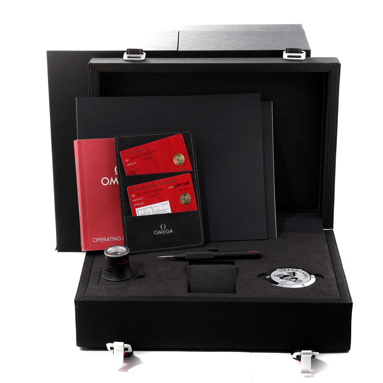 The image shows the packaging and accessories for an Omega Speedmaster 311.30.42.30.01.006 Men
s Stainless Steel Black Dial 311.30.42.30.01.006 Men
s Stainless Steel Black Dial, including a box, warranty cards, instruction manual, loupe, and tools.