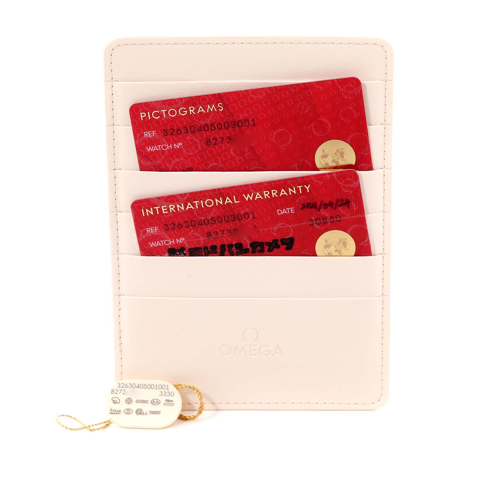 The image shows warranty cards and certifications for an Omega Speedmaster 326.30.40.50.03.001 Men
s Stainless Steel Blue Dial 326.30.40.50.03.001 Men
s Stainless Steel Blue Dial, along with tags in a branded holder.