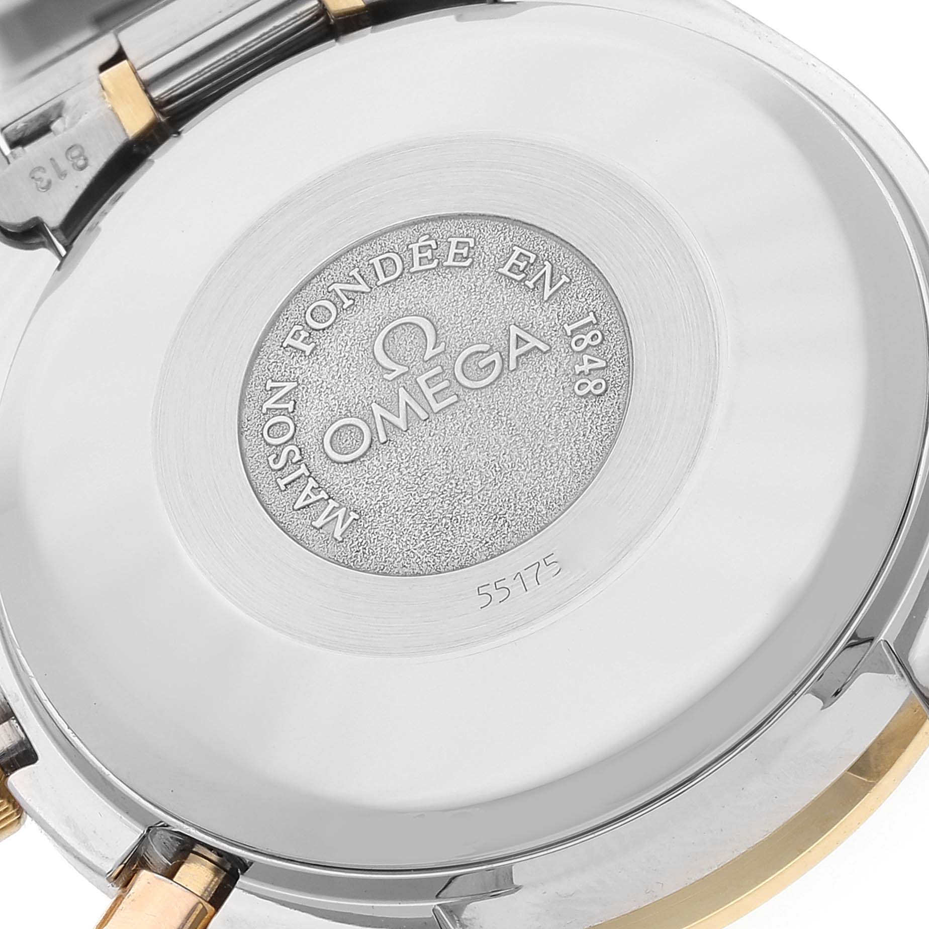 This image shows the case back of the Omega Speedmaster 3321.30.00 Men's Steel and Gold (two tone) Silver Dial 3321.30.00 Men's Steel and Gold (two tone) Silver Dial watch, highlighting the brand logo and some inscriptions.