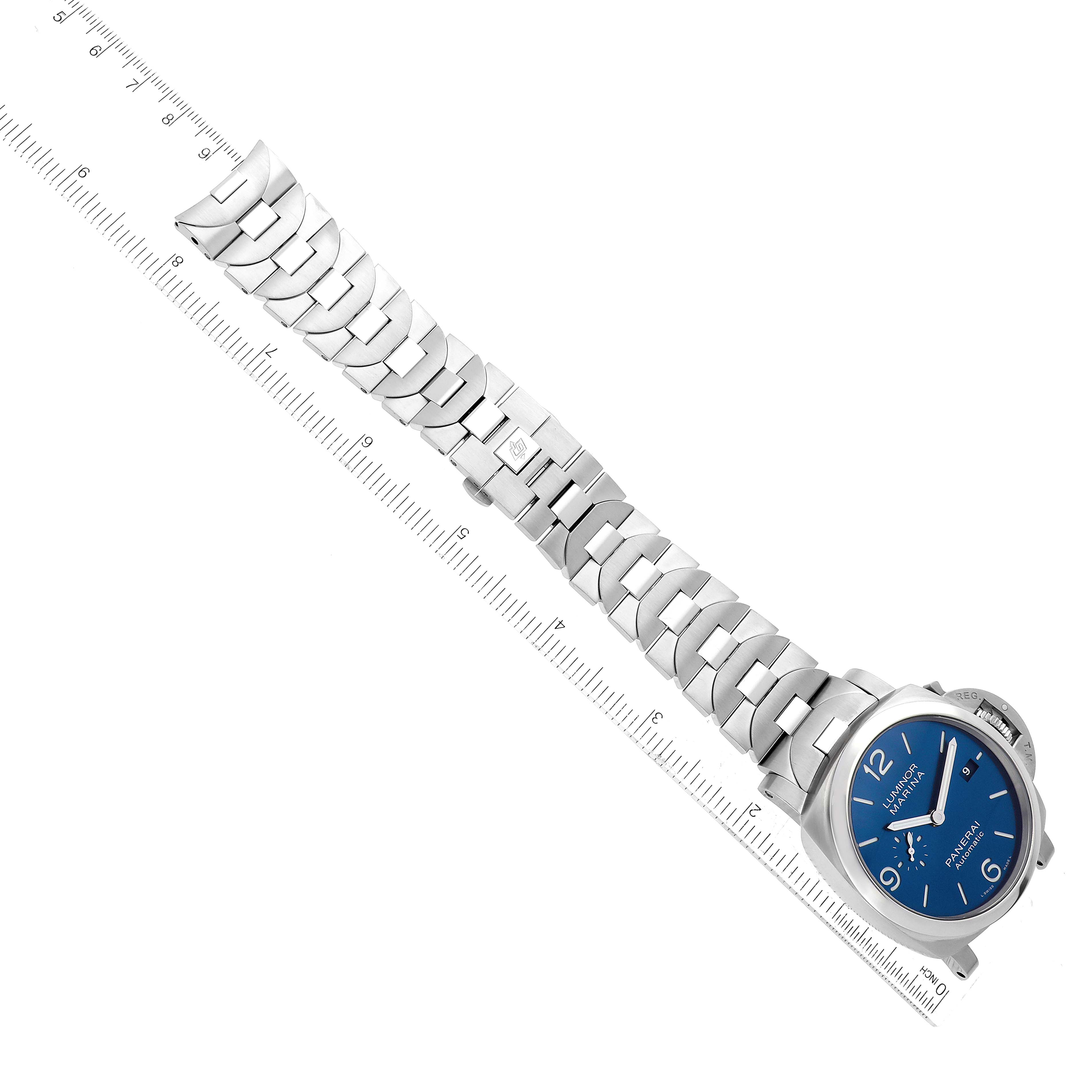 The image shows an overhead view of a Panerai Luminor PAM01316 Men's Stainless Steel Blue Dial PAM01316 Men's Stainless Steel Blue Dial watch with a blue dial and a stainless steel bracelet beside a ruler for measurement.