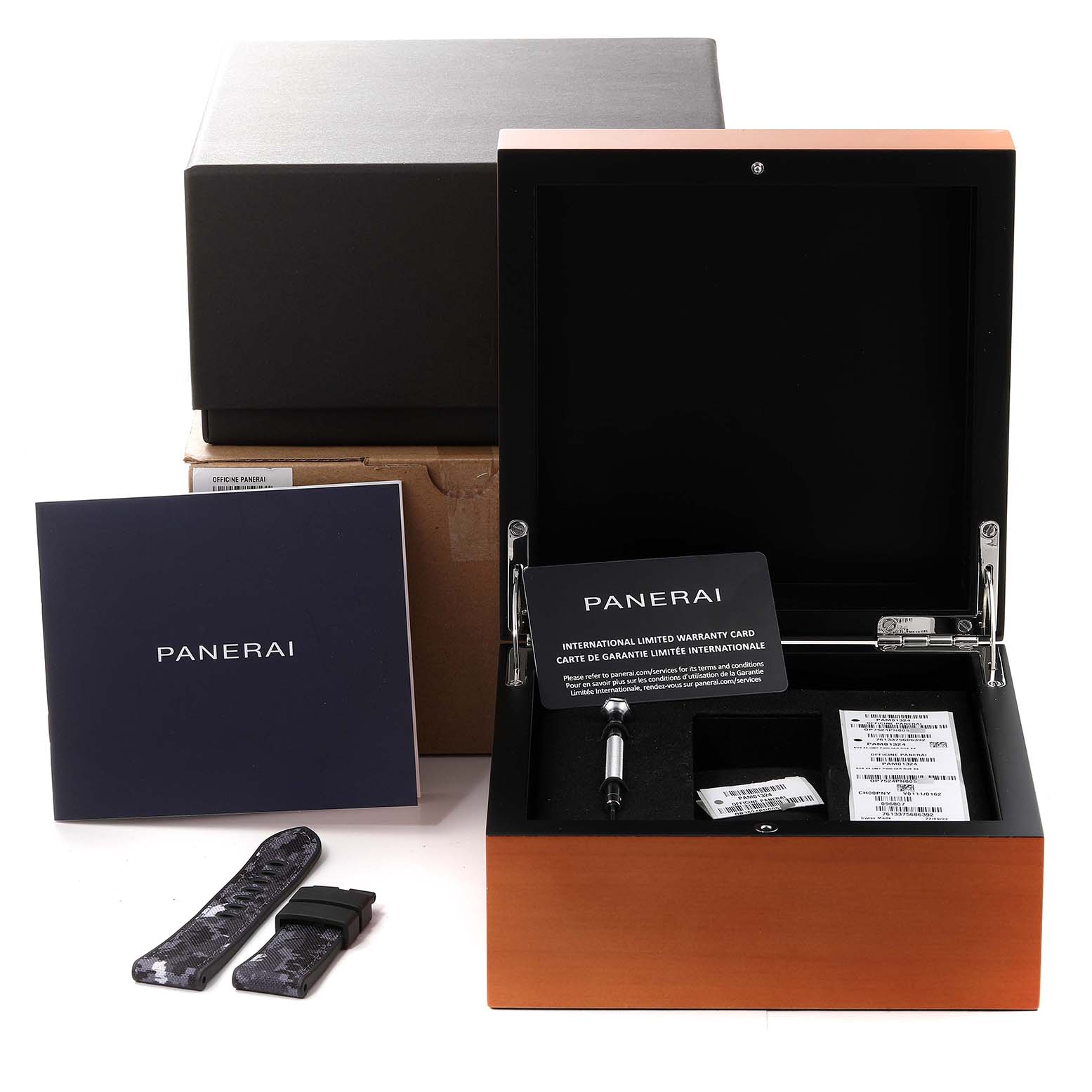 This image shows an open Panerai Submersible PAM01324 Men's Ceramic Grey Dial PAM01324 Men's Ceramic Grey Dial watch box with warranty cards, a tool, additional strap, and packaging.