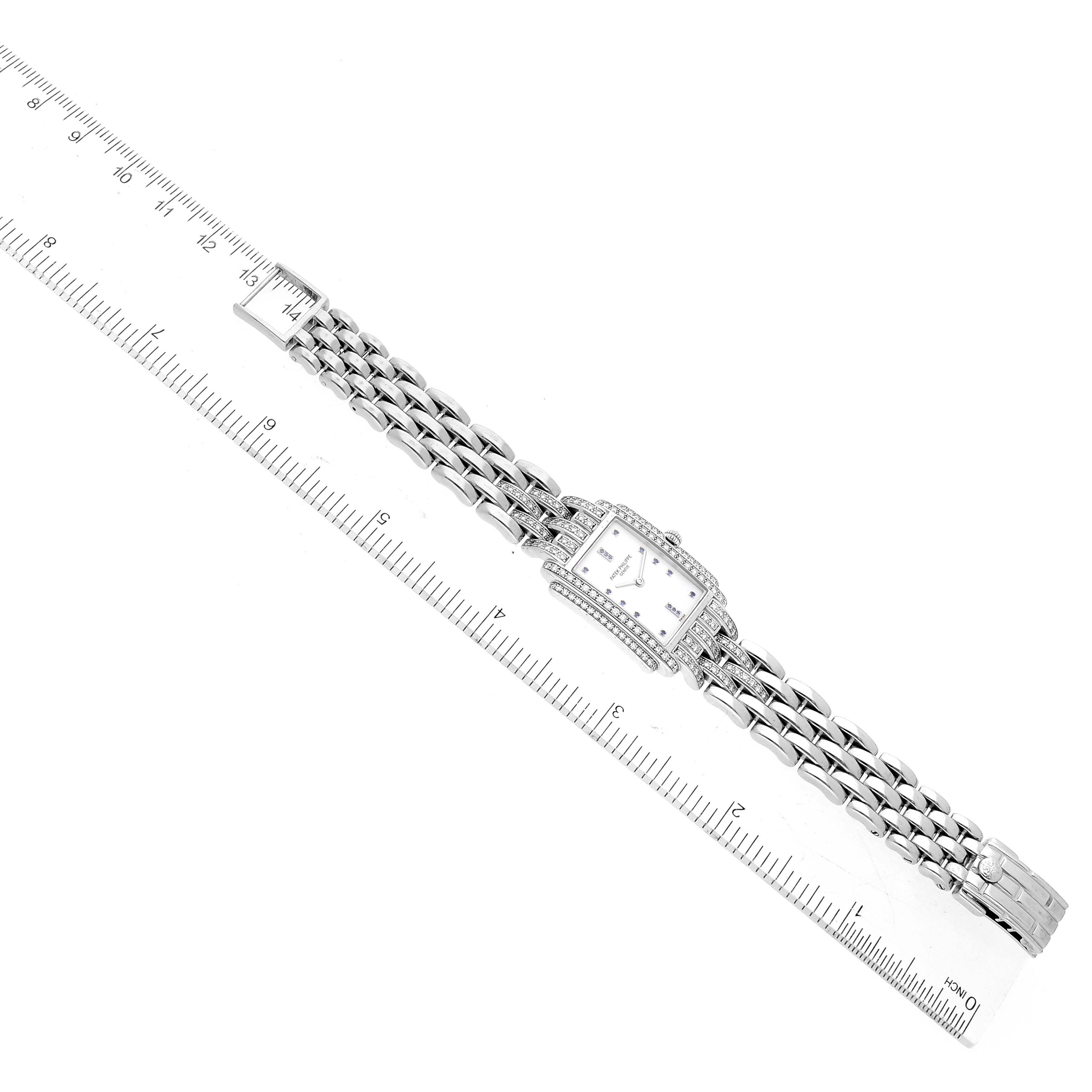 The image shows a top-down view of a Patek Philippe Gondolo 4825G Women's White Gold White Dial 4825G Women's White Gold White Dial watch, displaying its entire bracelet and rectangular face.