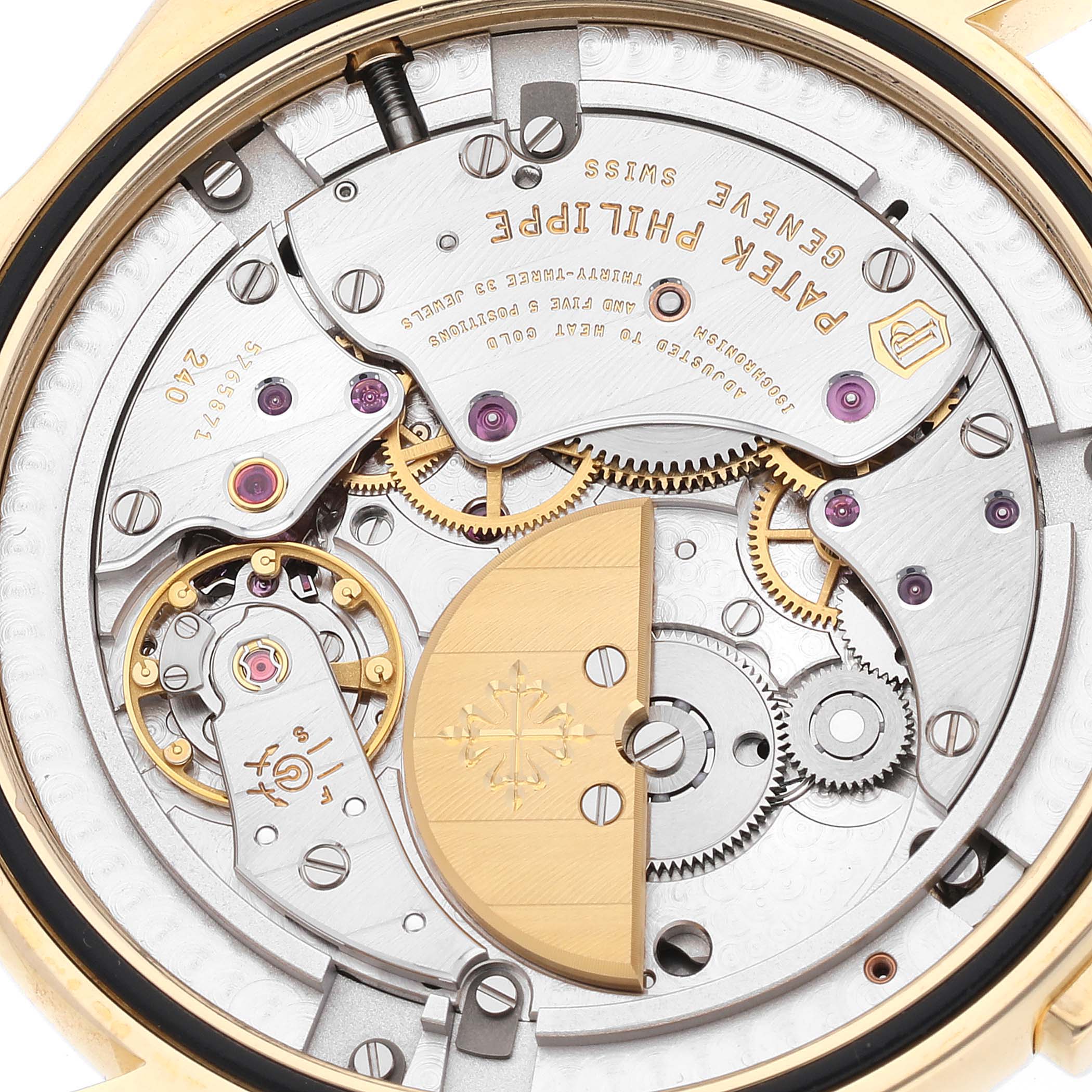 The image shows the intricate inner mechanism of a Patek Philippe Complications 5130J Men
s Yellow Gold Silver Dial 5130J Men
s Yellow Gold Silver Dial model at a close-up angle.
