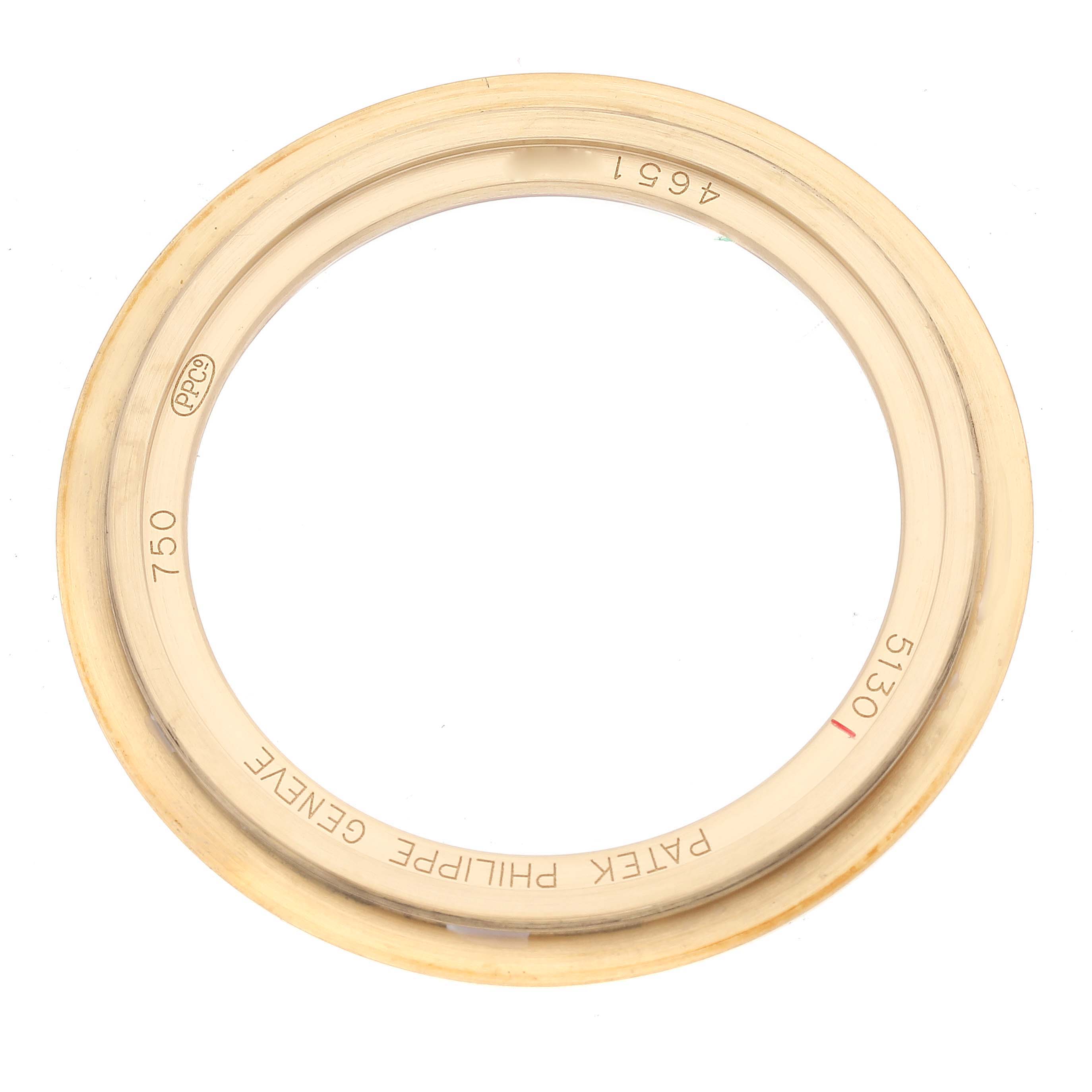 This image shows the bezel of a Patek Philippe Complications 5130J Men
s Yellow Gold Silver Dial 5130J Men
s Yellow Gold Silver Dial model watch from a top-down angle.